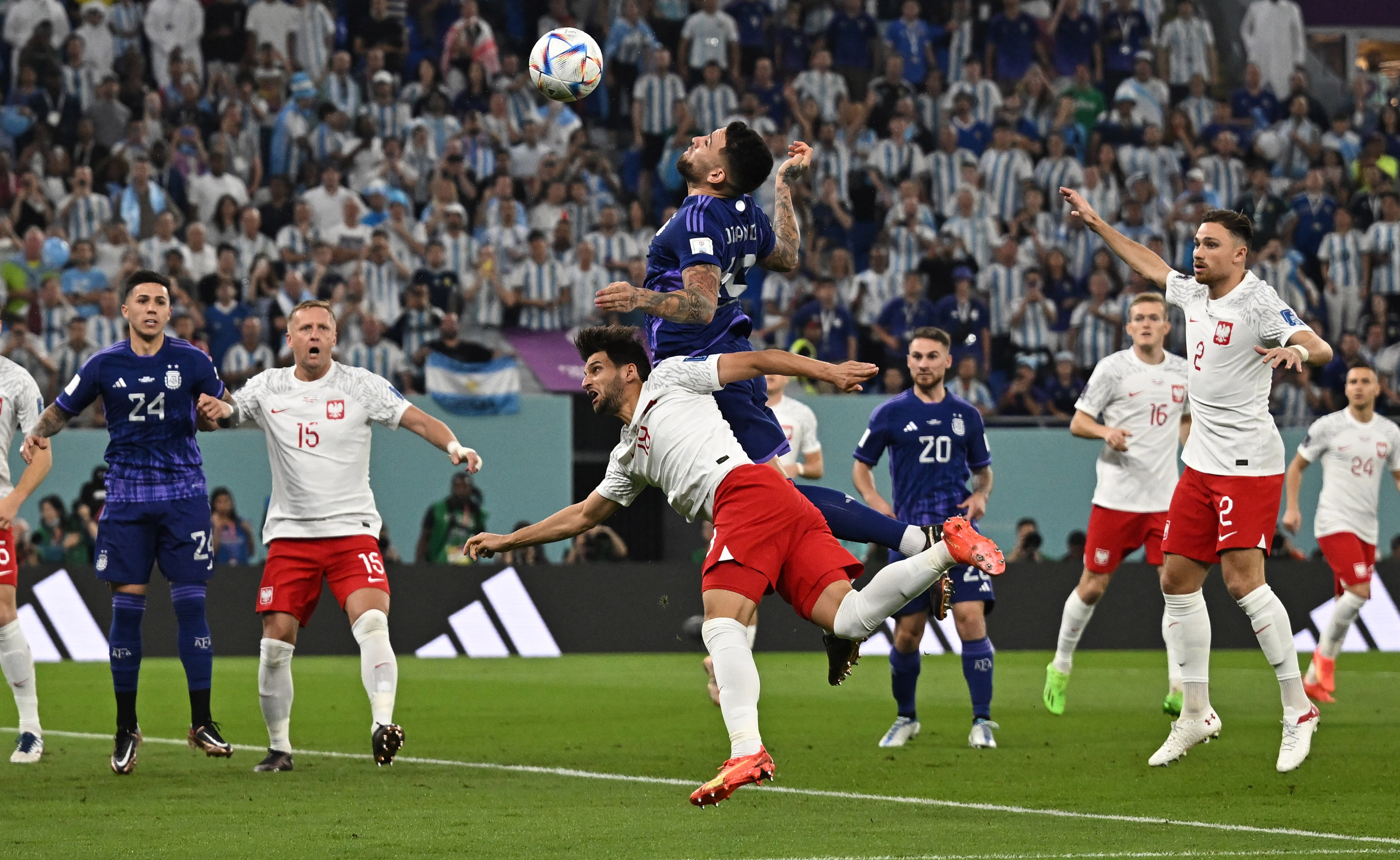 Poland's Bartosz Bereszynski in action with Argentina's Nicolas Otamendi