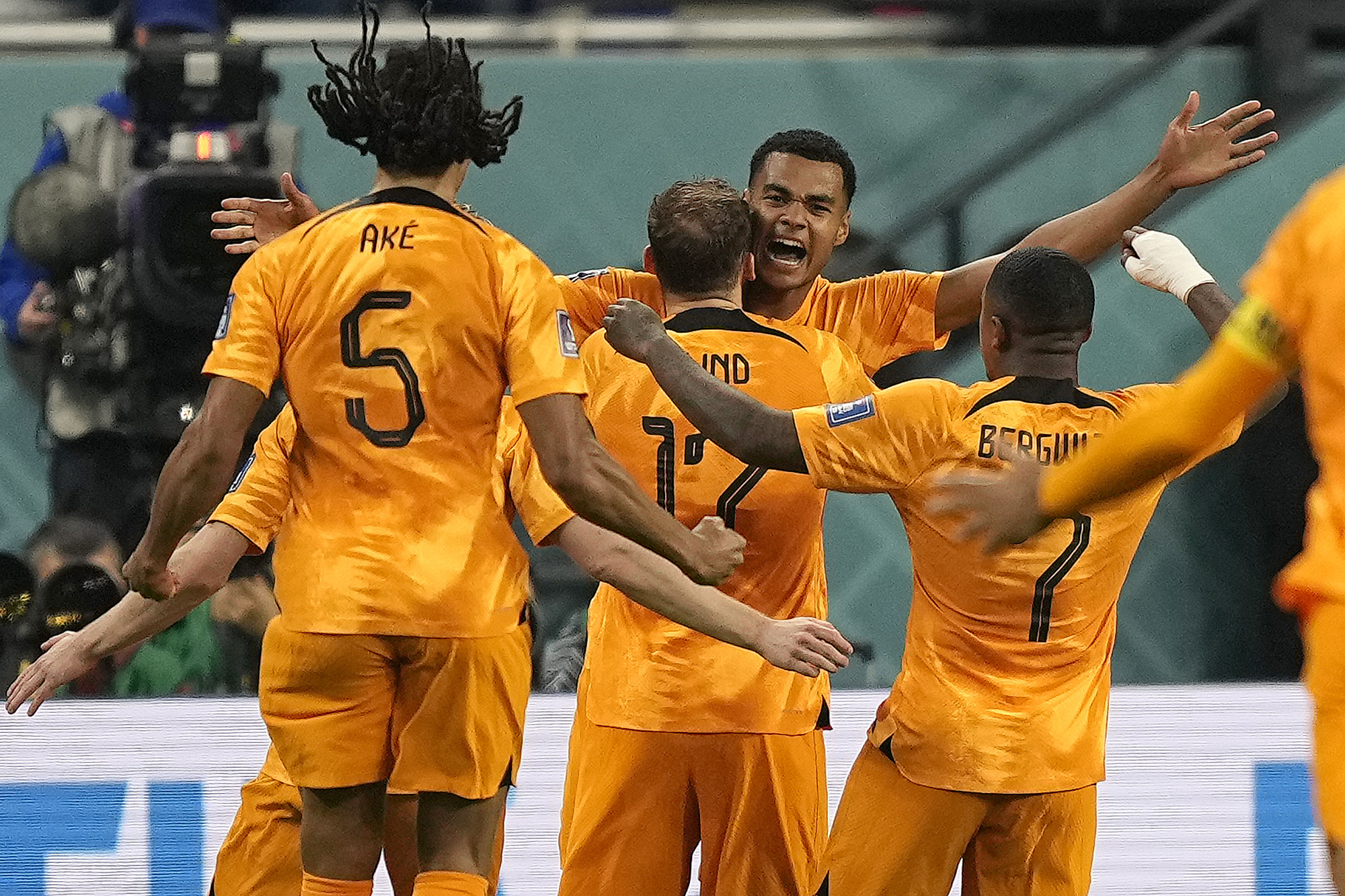 Cody Gakpo of the Netherlands (centre) celebrates with teammates after scoring his side’s first goal during the World Cup group A football match between Netherlands and Ecuador, at the Khalifa International Stadium in Doha, Qatar, on November 25, 2022
