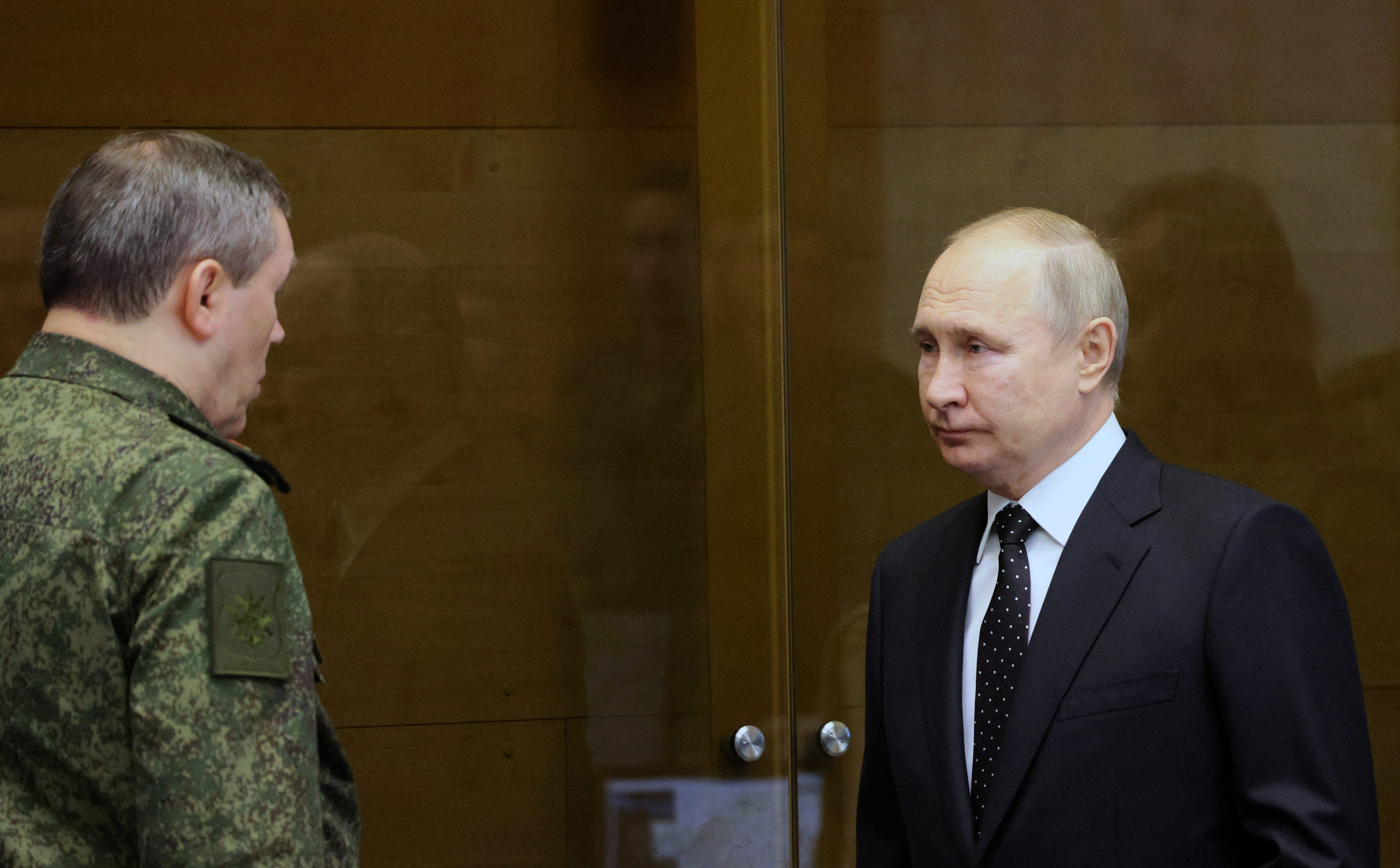 Chief of the Russian General Staff Valery Gerasimov greets Russian President Vladimir Putin during a visit to the joint headquarters of the Russian armed forces.
