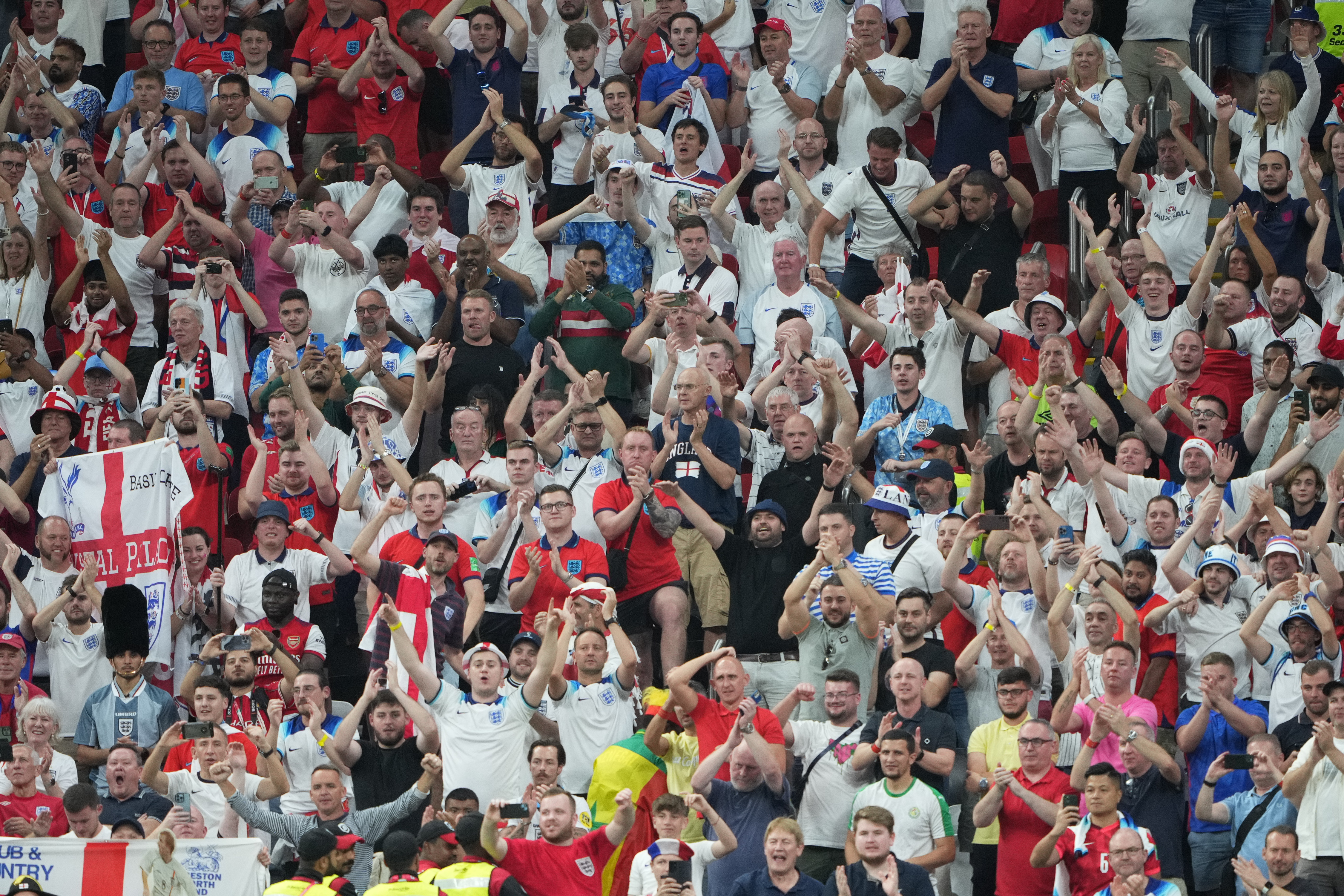 England fans celebrating their victory over Senegal