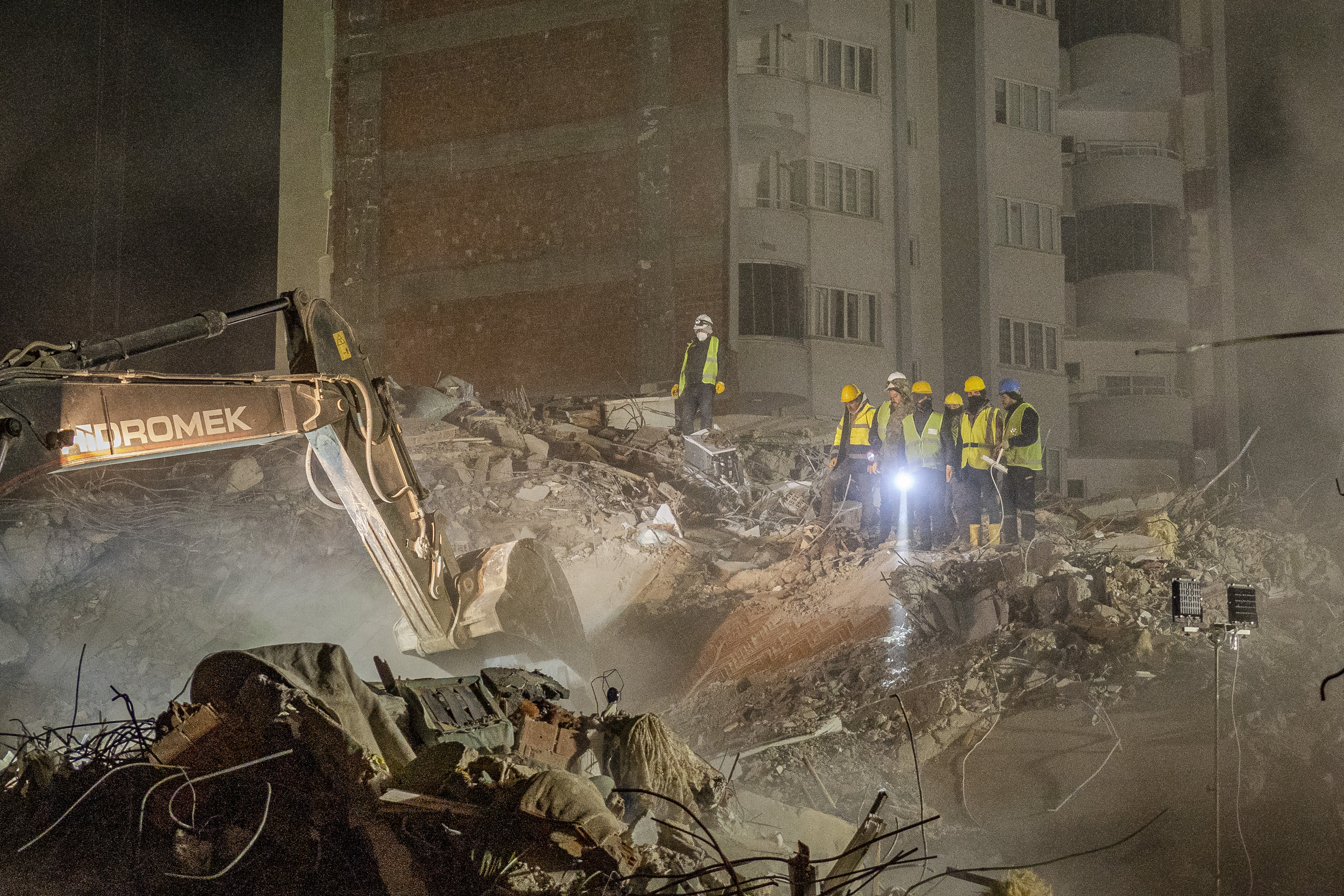 A group of rescue workers stands above the rubbles to have a better visual over the collapse. “We’re always hoping for a miracle, that there may still be survivors, even if just a cat,” says Levant. “But after the first day we haven’t heard voices anymore.”