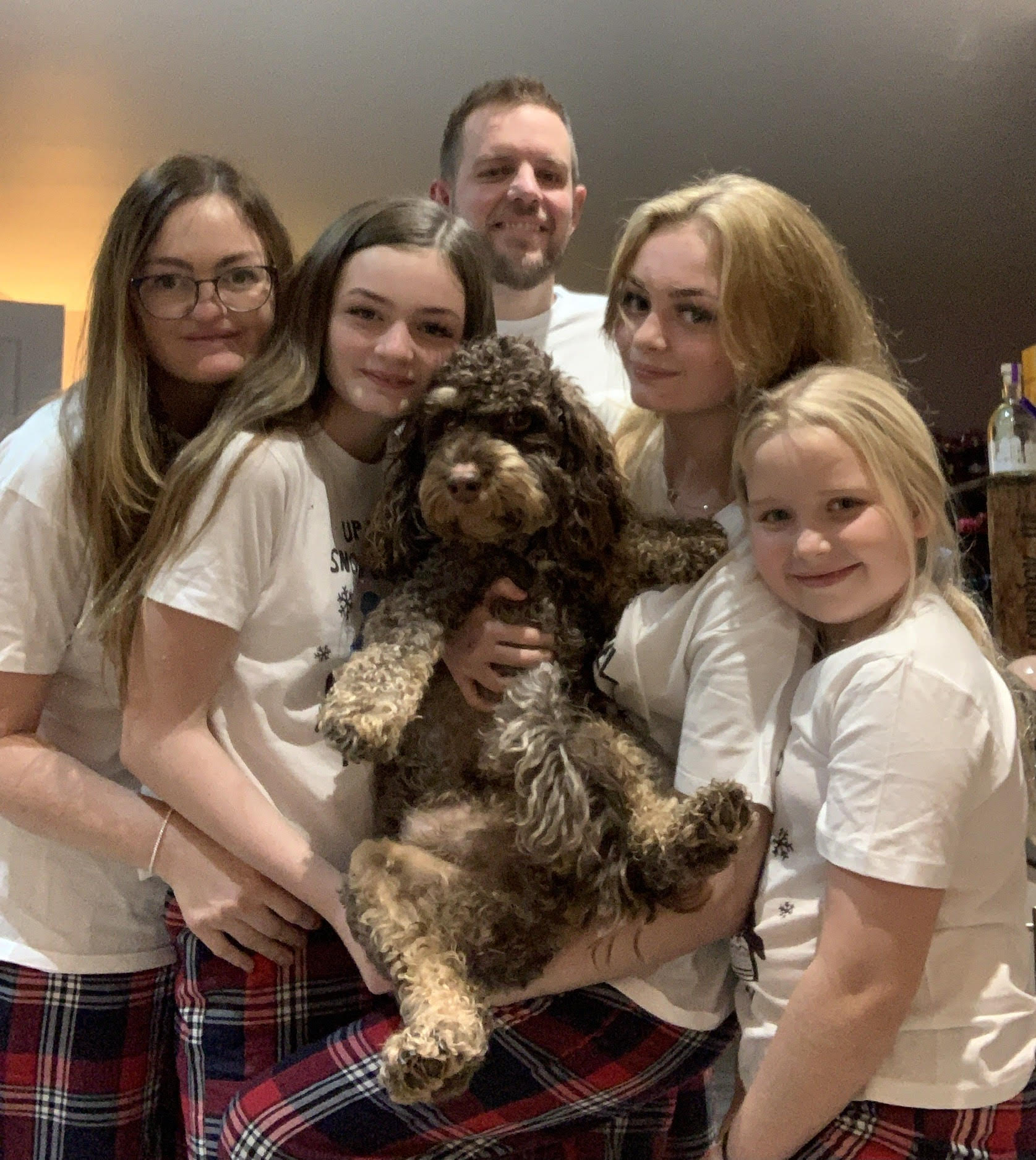 Helen Bone, her husband, three daughters and their dog [Courtesy of Helen Bone]