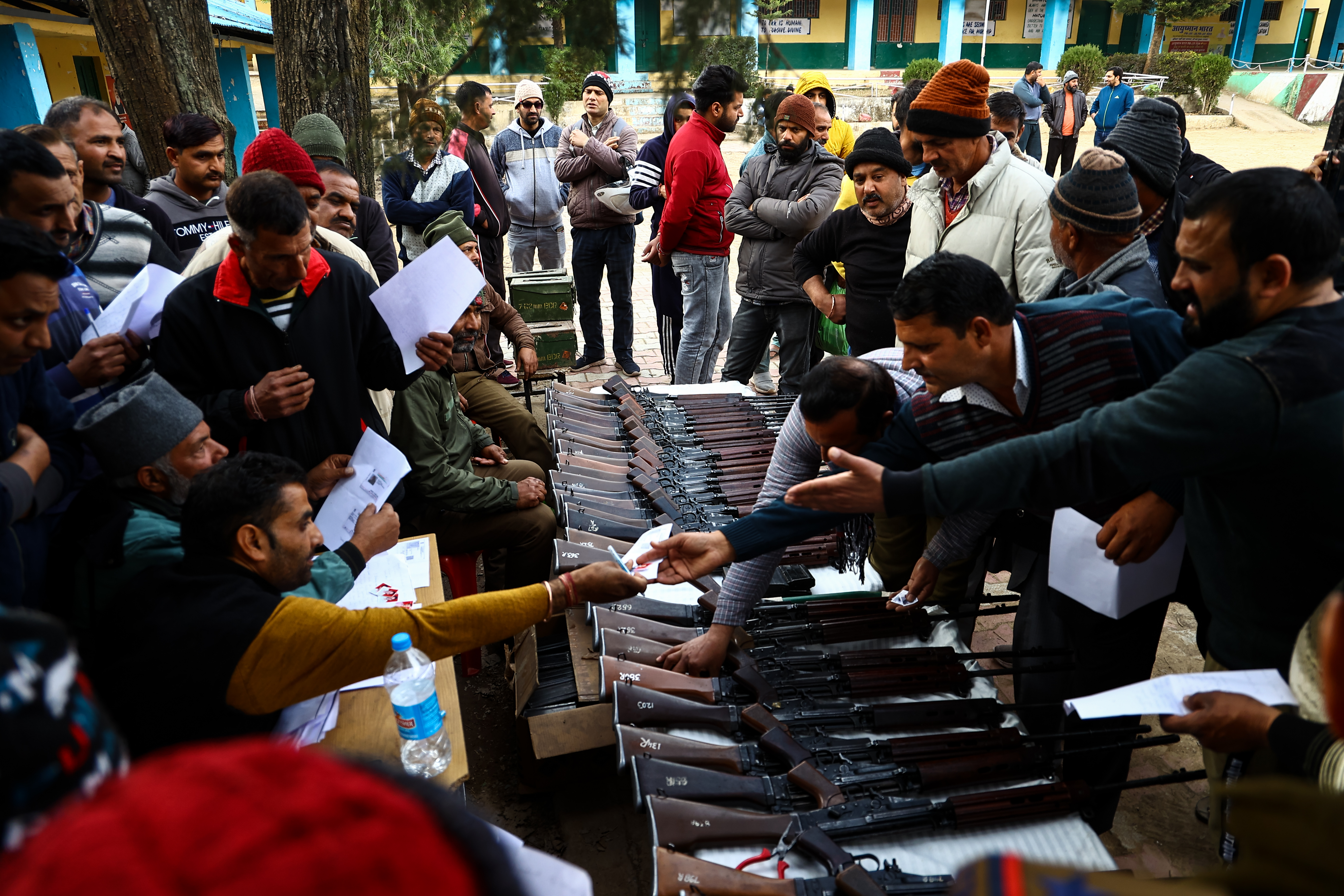 Authorities distribute SLR Rifles among Ex-servicemen after Village defence groups or VDCs were being revamped in Dhangri Village of Rajouri Jammu and Kashmir