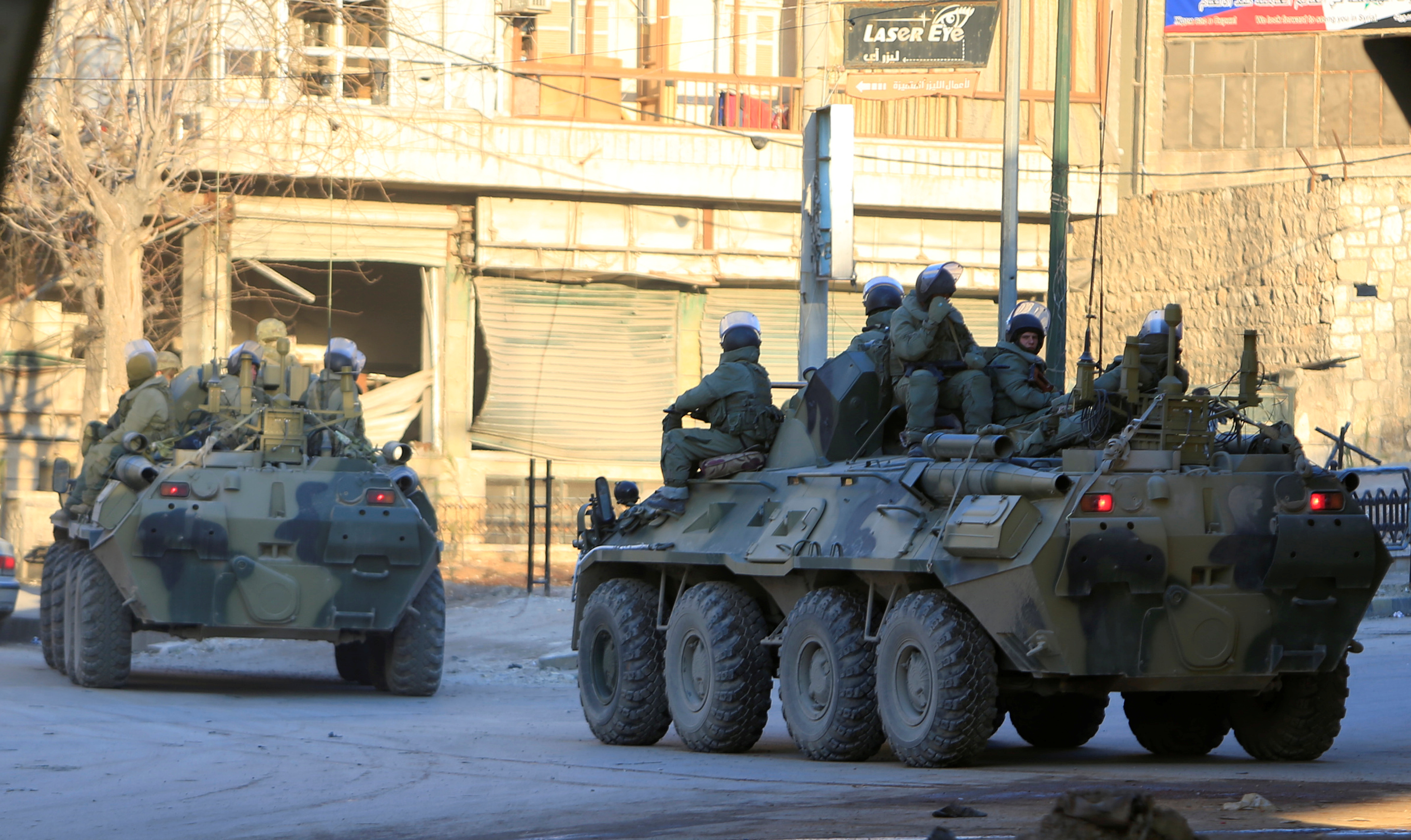 Russian soldiers, on armoured vehicles, patrol a street in Aleppo, Syria February 2, 2017. REUTERS/Ali Hashisho