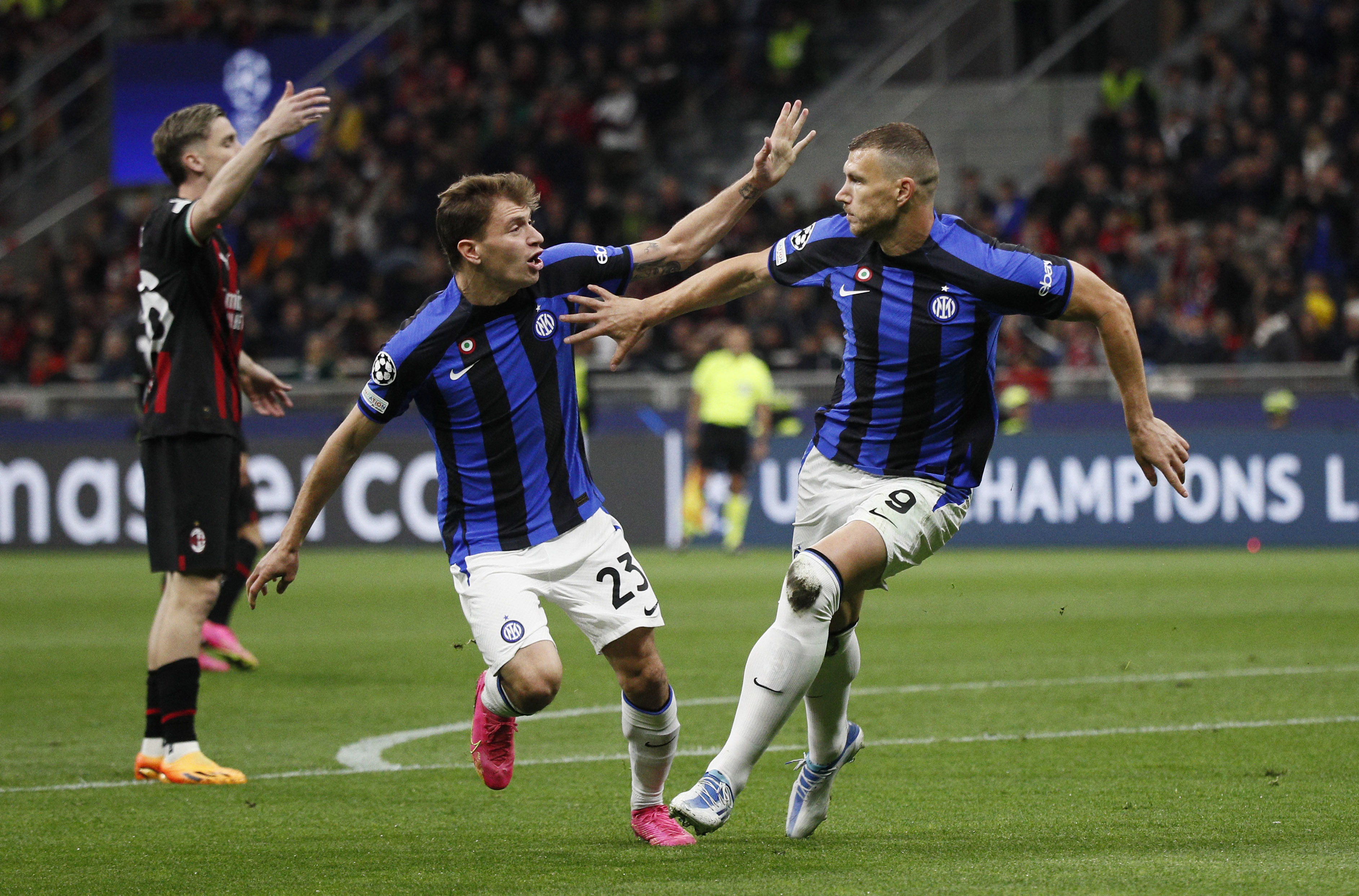 Dzeko, right, celebrates scoring with Nicolo Barella