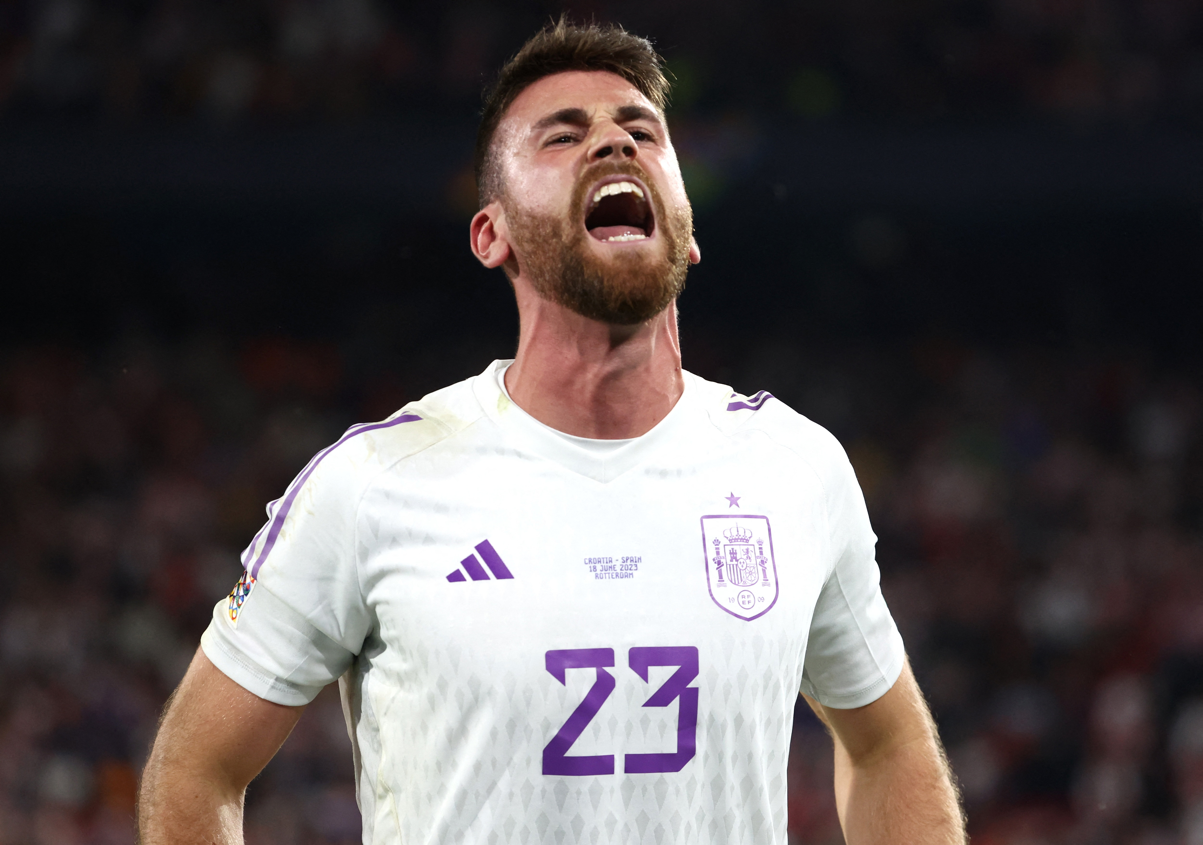 Spain's Unai Simon celebrates after winning the penalty shootout and the UEFA Nations League final