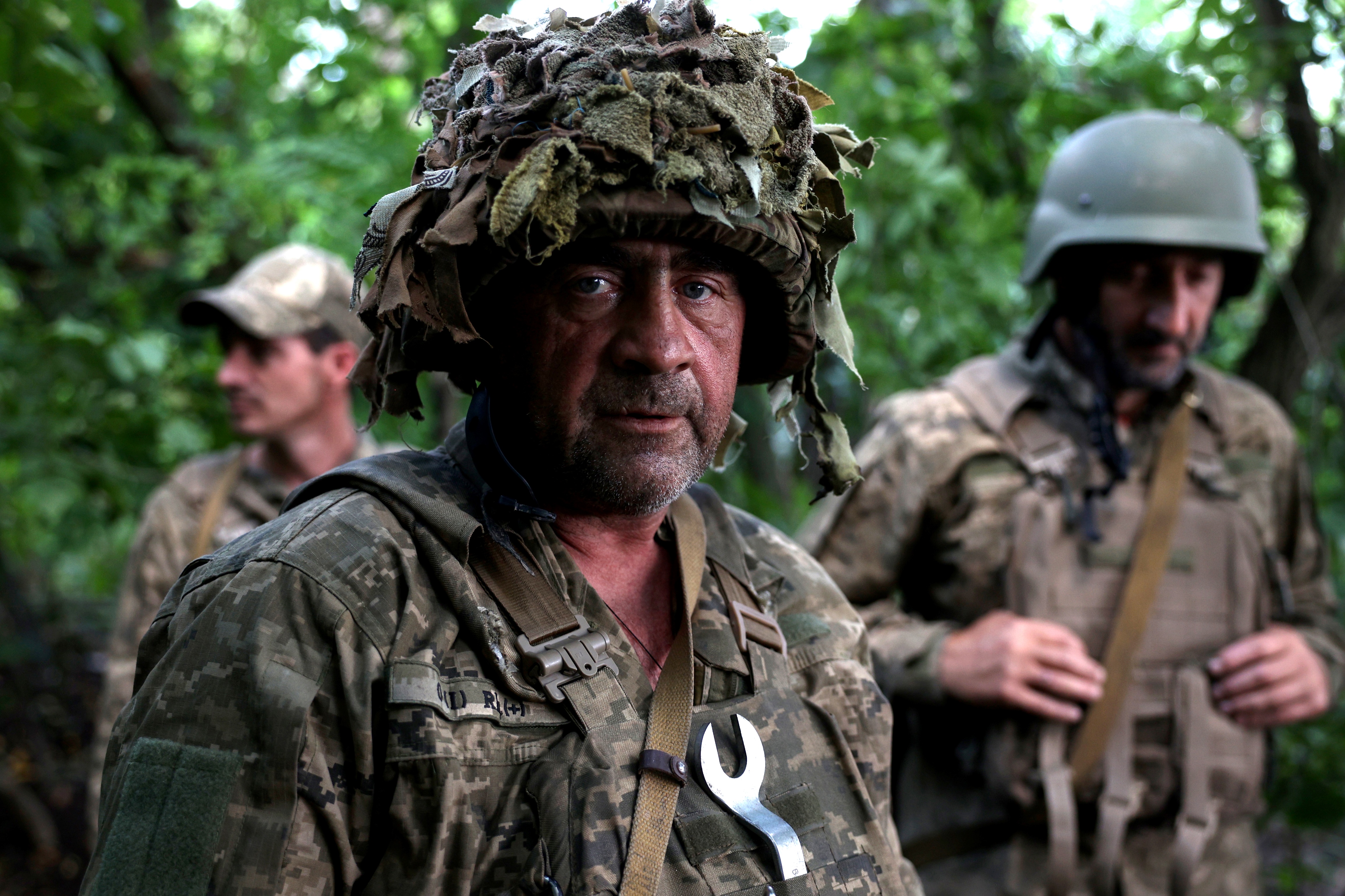 A Ukrainian artilleryman poses as he holds a position at the frontline near the town of Bakhmut, Donetsk region