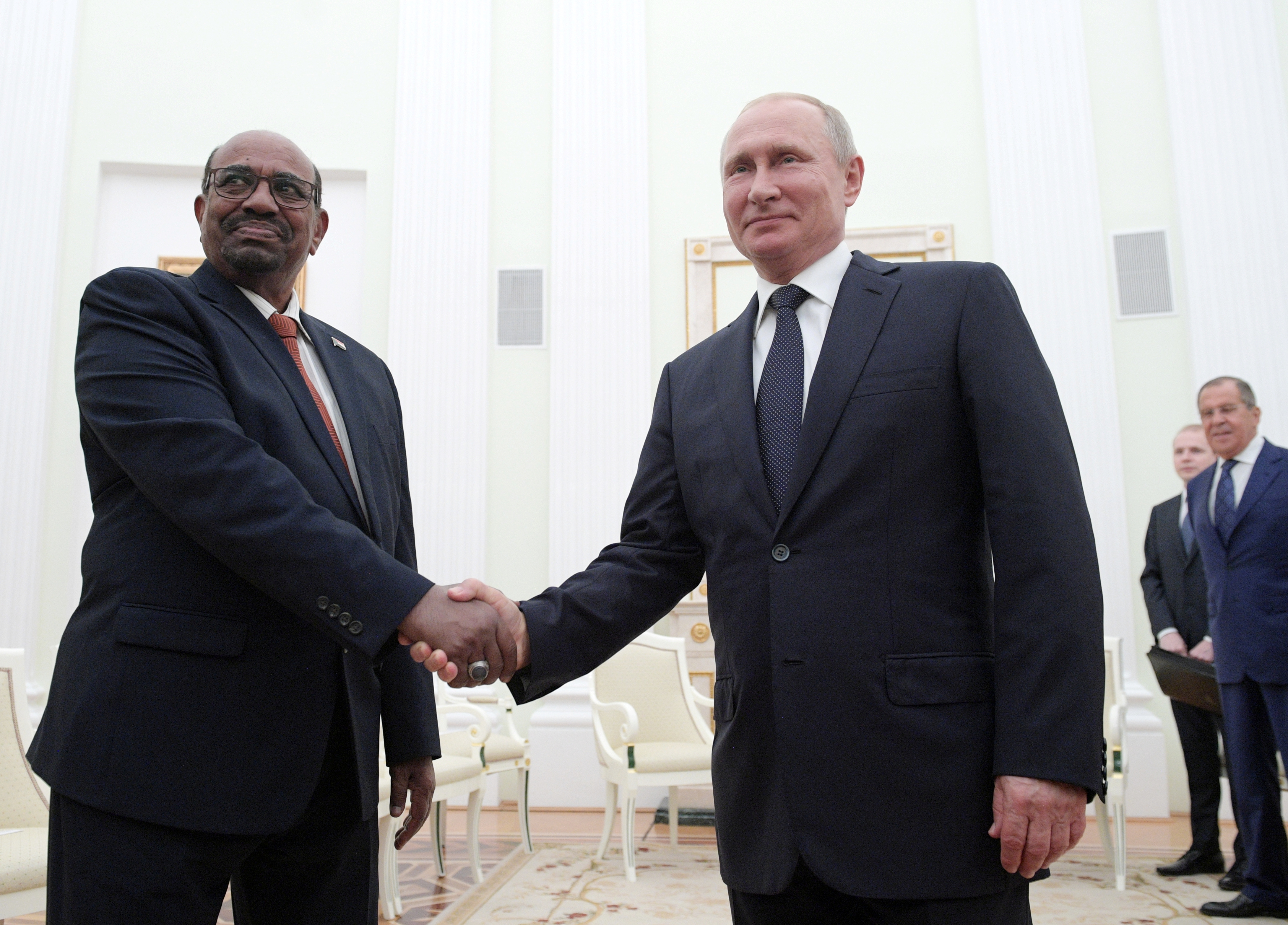 Russian President Vladimir Putin (R) mshakes hands with Sudanese President Omar al-Bashir during a meeting at the Kremlin in Moscow, Russia July 14, 2018. Sputnik/Alexei Druzhinin/Kremlin via REUTERS ATTENTION EDITORS - THIS IMAGE WAS PROVIDED BY A THIRD PARTY.