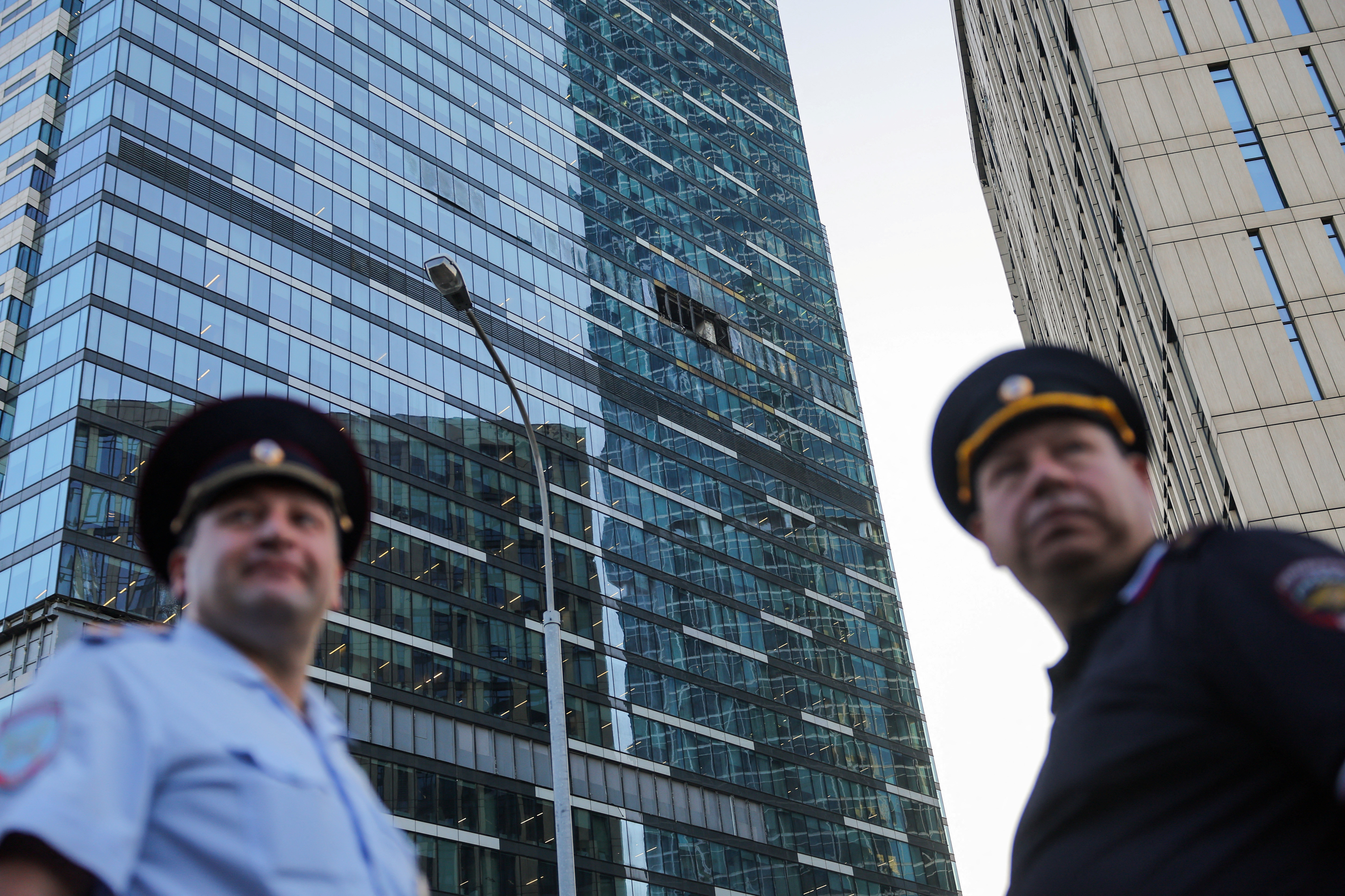 Emergency personnel work near a damaged office building in the Moscow City following a reported Ukrainian drone attack in Moscow Russia, August 1, 2023.
