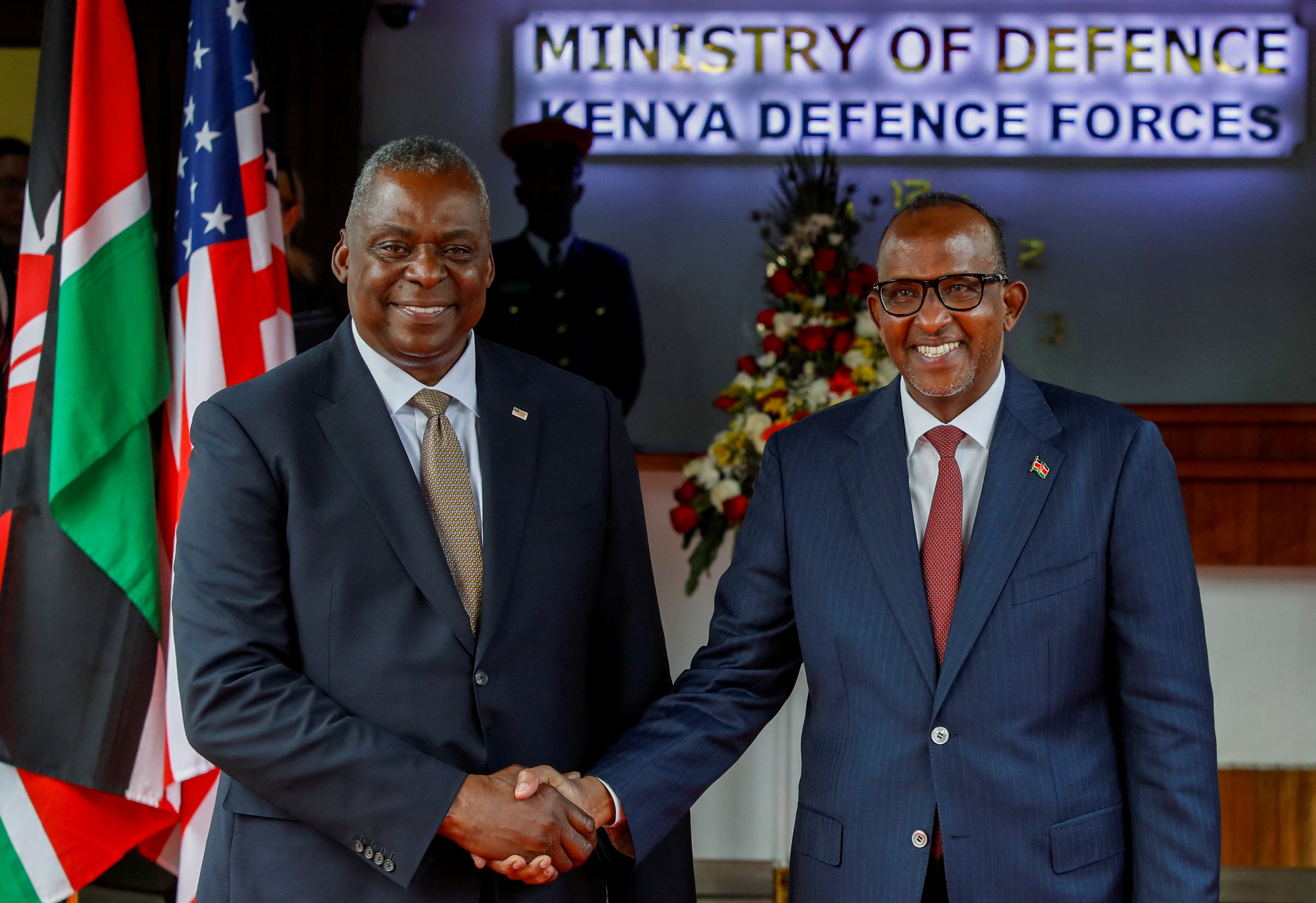 US Secretary of Defense Lloyd Austin and Kenya's Cabinet Secretary for Defence Aden Duale shake hands