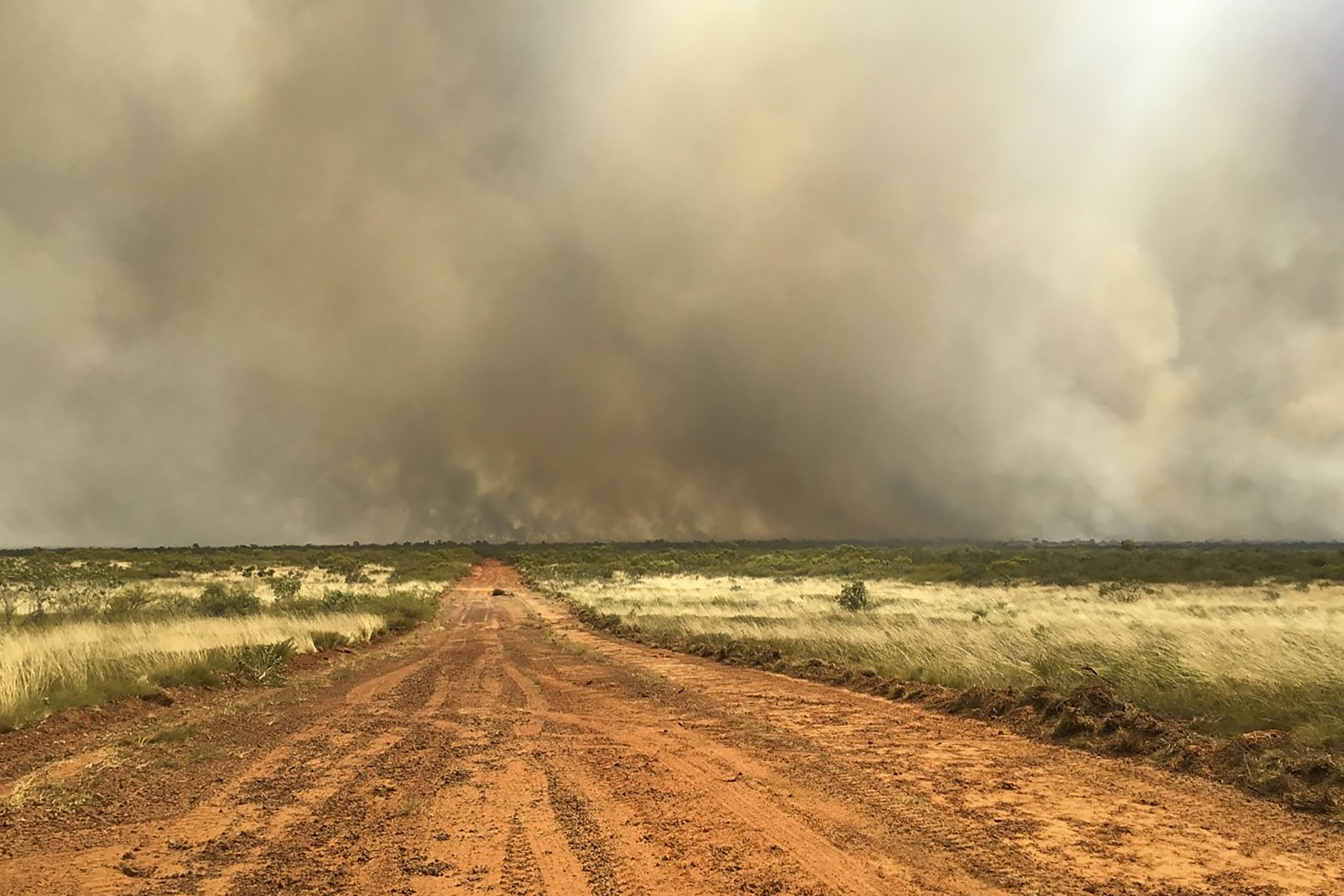 In this photo released by Bushfires NT, a large bushfire burns in the Outback of Australia near Tennant Creek in the Northern Territory, Wednesday, Sept. 13, 2023. Emergency crews were working to protect the Outback Australian town of Tennant Creek with containment lines on Wednesday as a huge wildfire threatened the remote community of 3,000. (Bushfires NT via AP)
