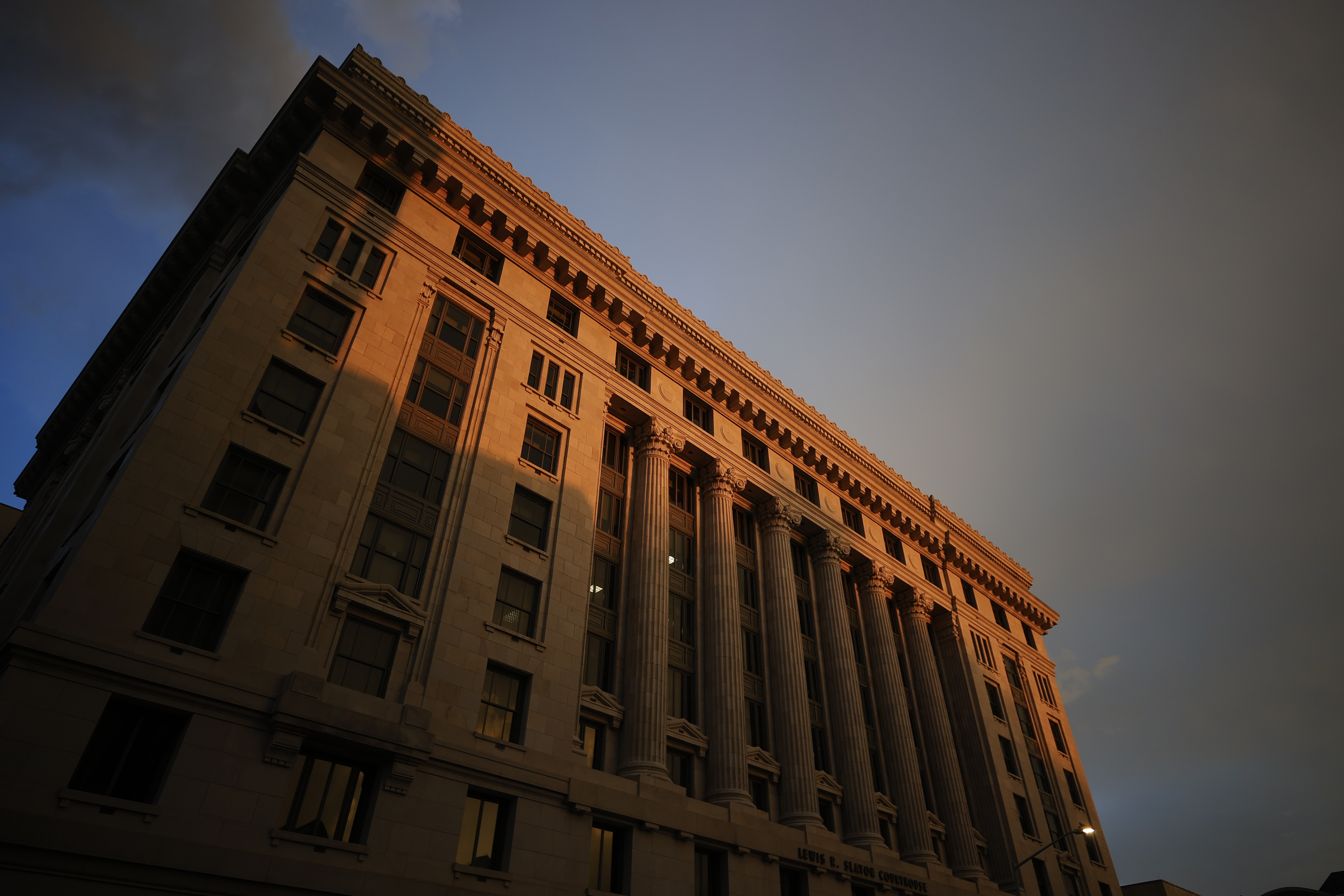The sun sets on the Fulton County Courthouse, Monday, Aug. 14, 2023, in Atlanta.