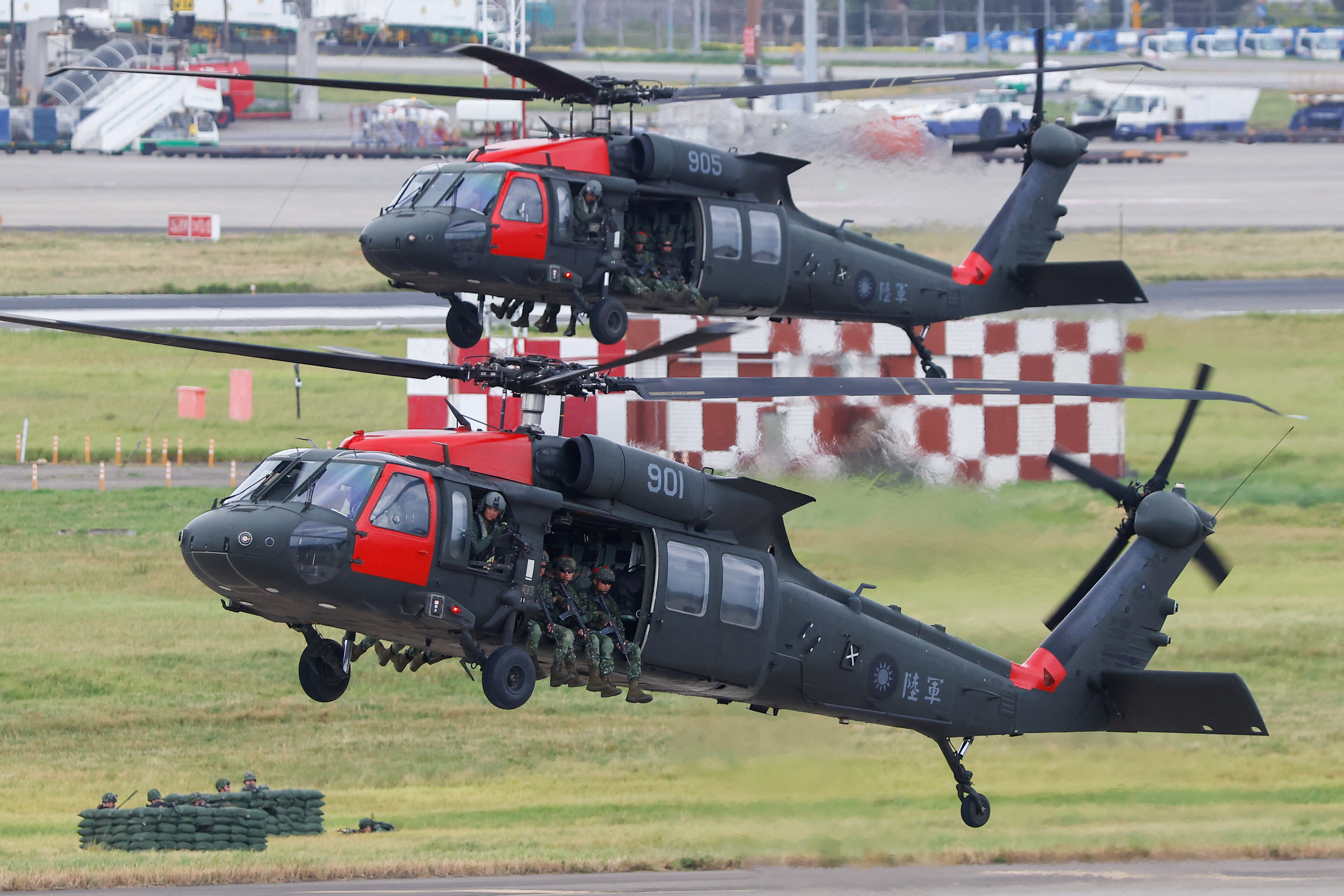 Black Hawk helicopters prepare to land at Taoyuan International Airport during the annual Han Kuang military exercises in July