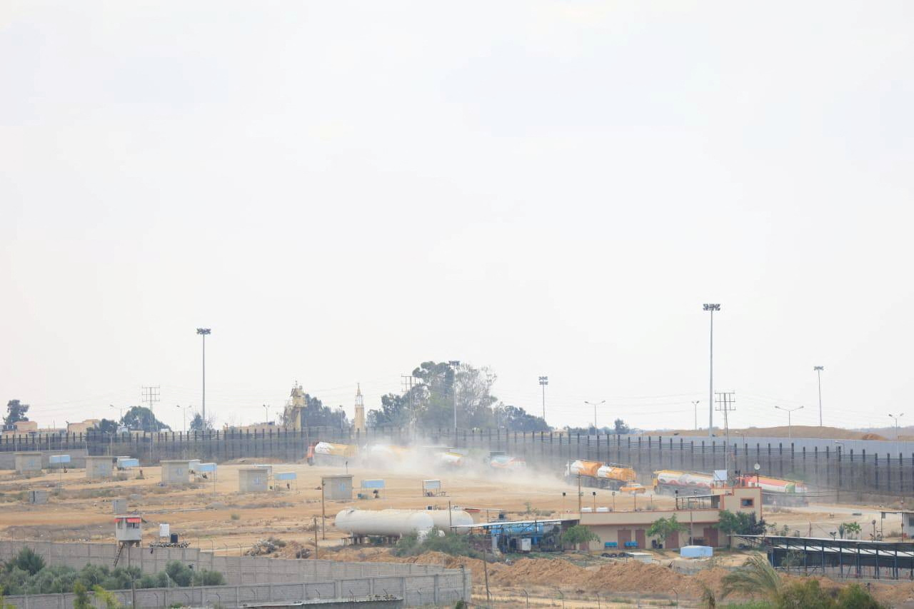 Trucks carrying aid are seen near the Gaza border with Egypt
