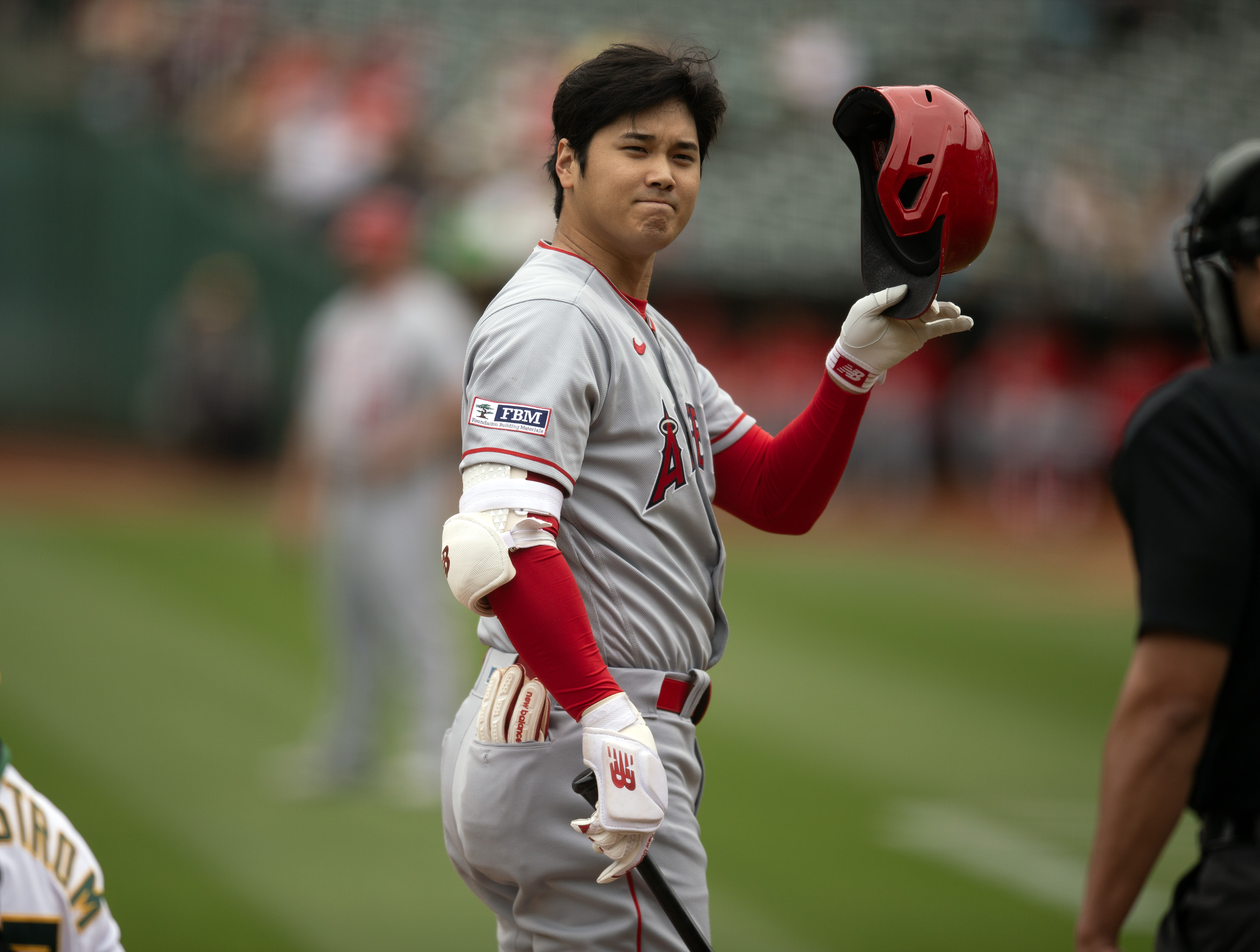 Angels designated hitter Shohei Ohtani takes off his helmet