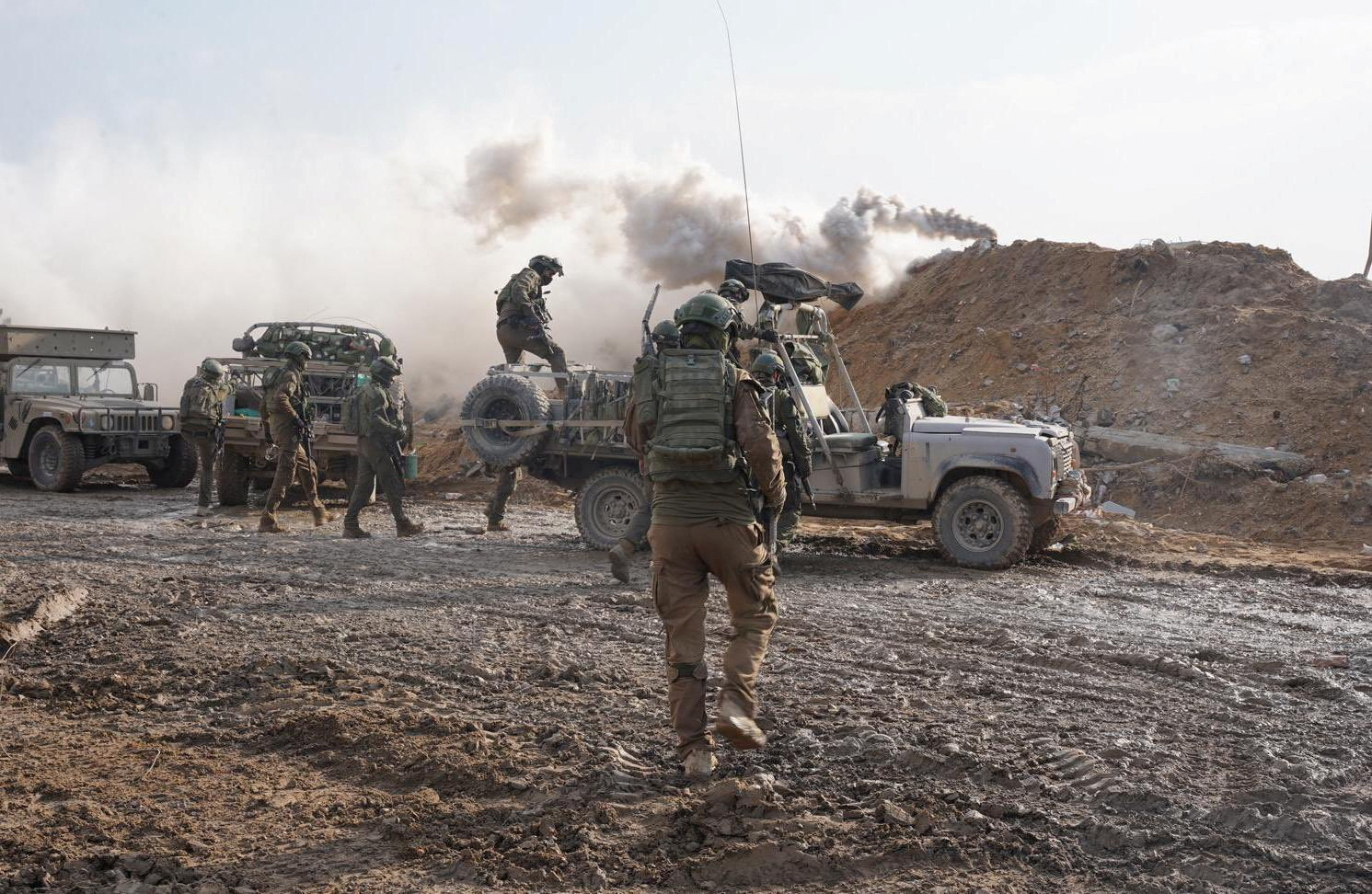 Israeli soldiers operate in the Gaza Strip amid the ongoing conflict between Israel and the Palestinian Islamist group Hamas, in this handout picture released on December 14, 2023