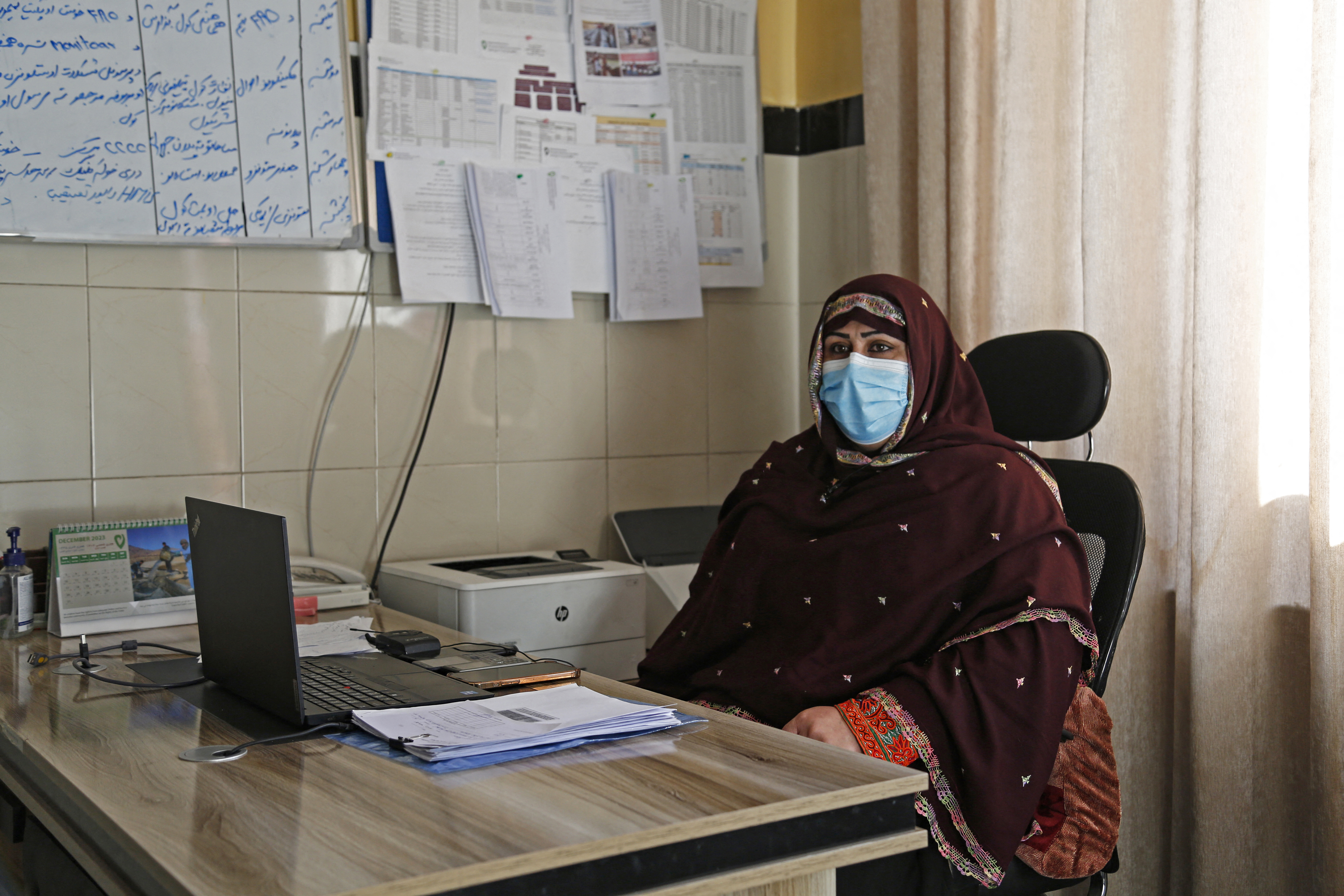 In this photograph taken on December 7, 2023, Nasrin Oryakhil, manager at Norwegian Afghanistan Committee (NAC)-run Comprehensive-Continuum of Care Centre, a maternity hospital, speaks during an interview with AFP at her office in the facility at Gardez, the capital of Afghanistan's Paktia province.