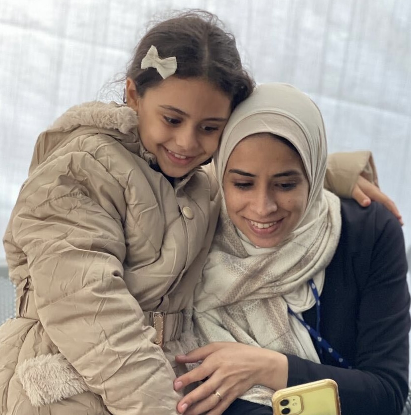 The author with her eight-year-old daughter at the Al Aqsa Martyrs Hospital in Deir el-Balah, Gaza Strip, on November 30, 2023 — less than a day before Israel's bombing started again [Maram Humaid/Al Jazeera]