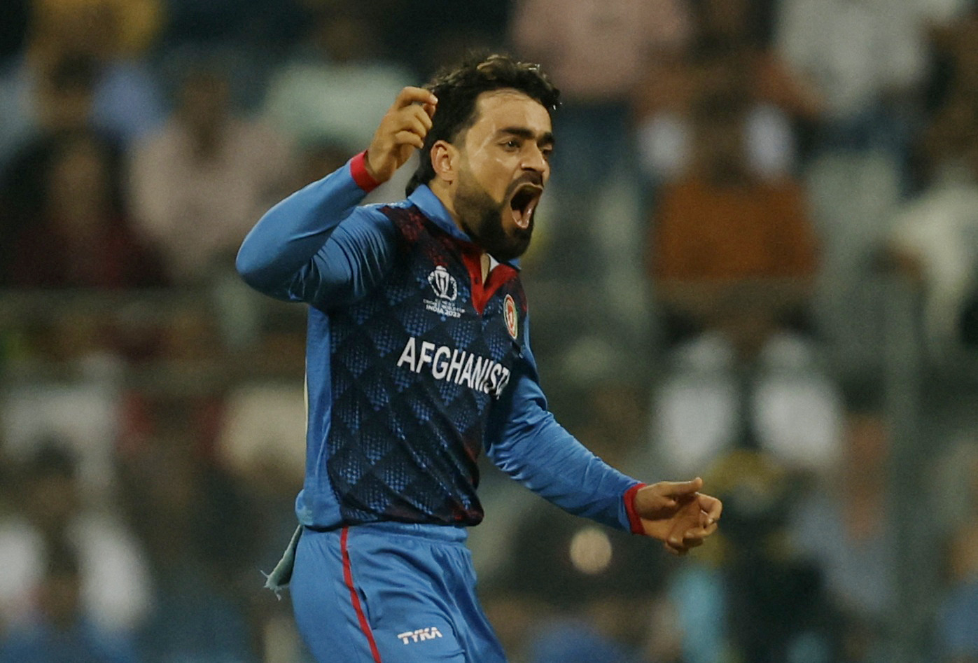 Cricket - ICC Cricket World Cup 2023 - Australia v Afghanistan - Wankhede Stadium, Mumbai, India - November 7, 2023 Afghanistan's Rashid Khan reacts REUTERS/Francis Mascarenhas
