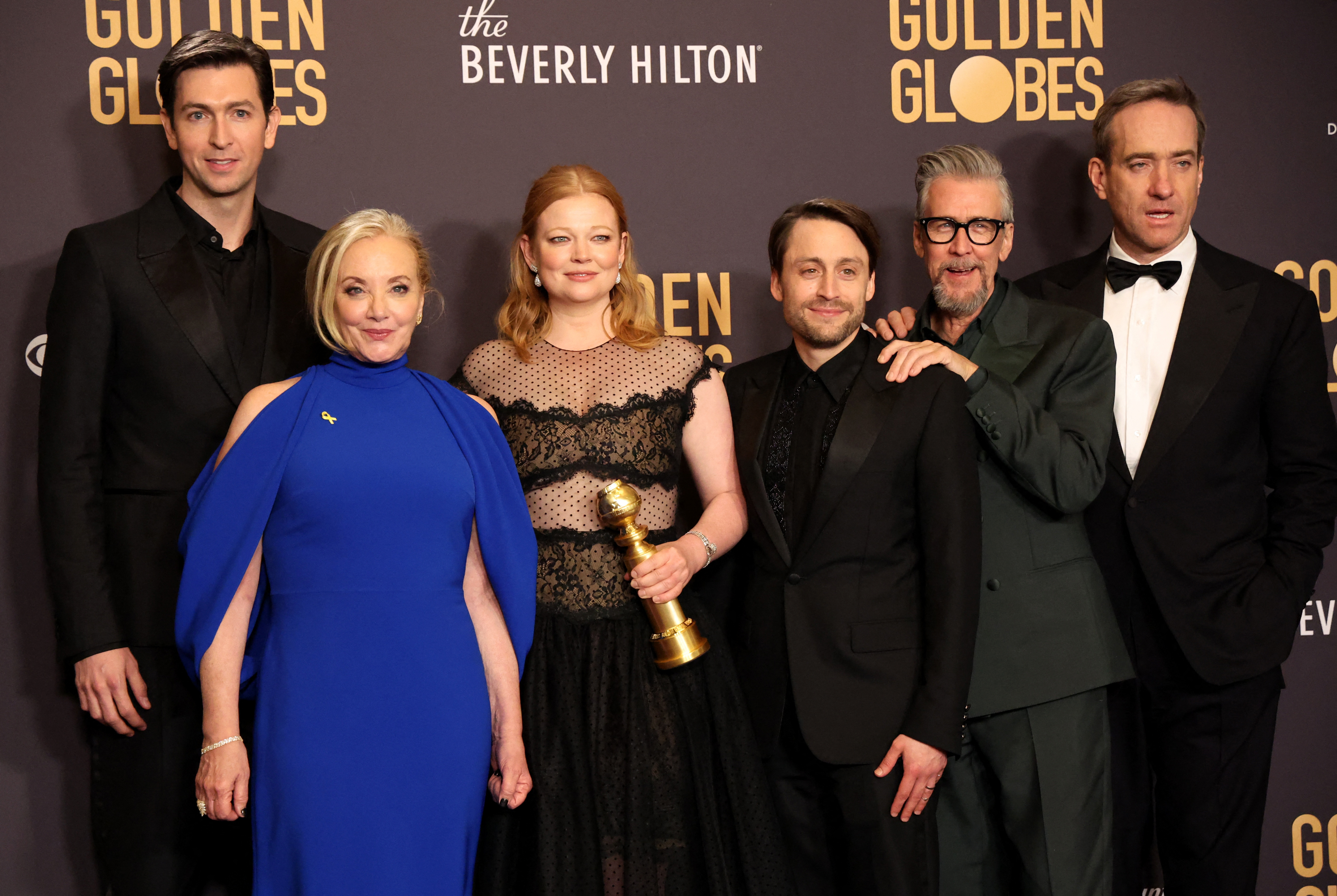The cast of Succession celebrates winning best television drama. Sarah Snook (third left), Kieran Culkin (third right) and Matthew Macfadyen (right) also took home acting awards
