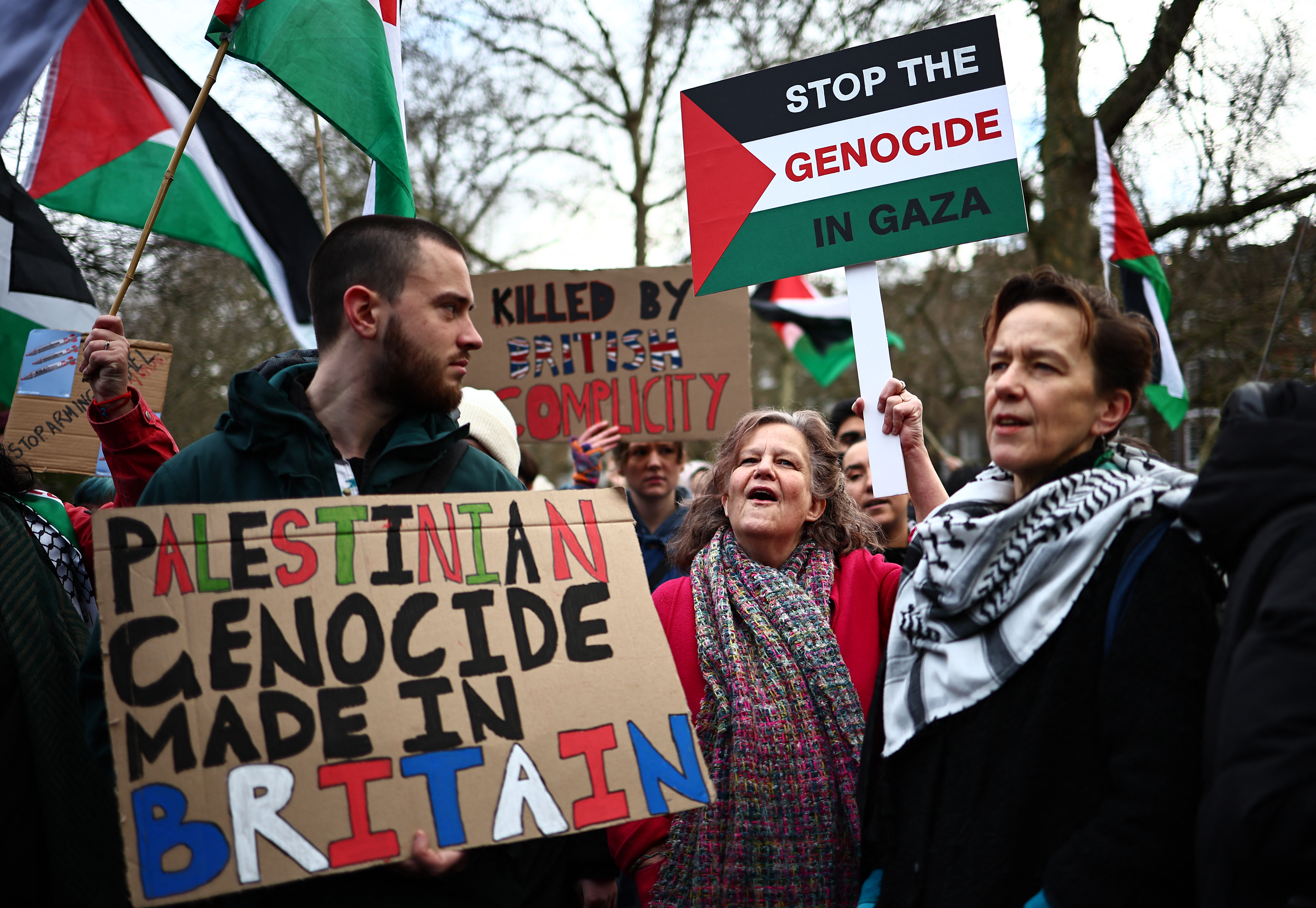 Pro-Palestinian activists and supporters wave Palestinian flags and hold placards during a demonstration in central London on January 6, 2024, calling for a ceasefire in Israel's war on Gaza [Henry Nocholls/AFP]