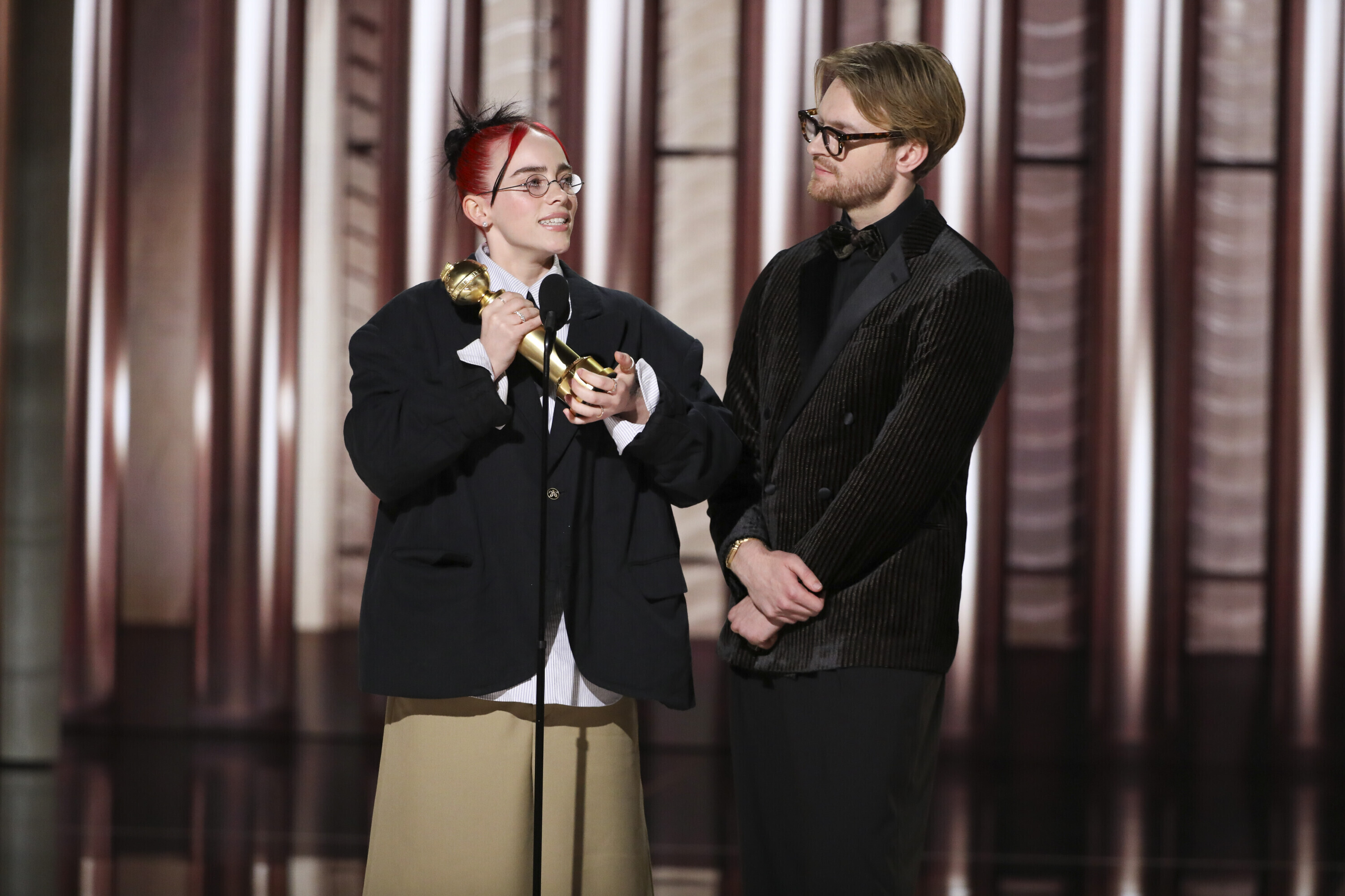 Billie Eilish and her brother Finneas O’Connell accepting the award for best original song What Was I Made For? from the film Barbie