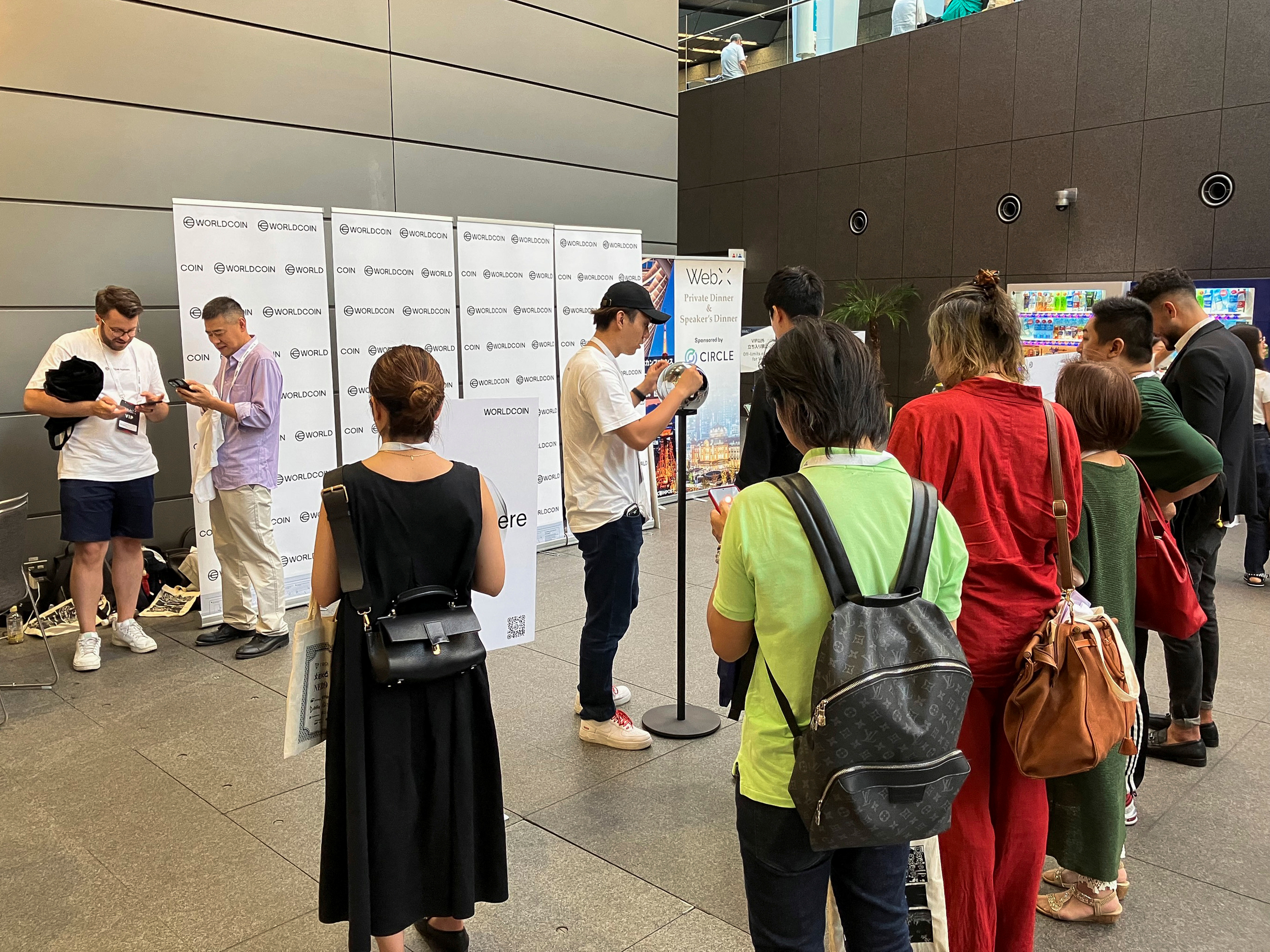 People queue to use WorldCoin's iris-scanners in Tokyo, Japan July 25, 2023