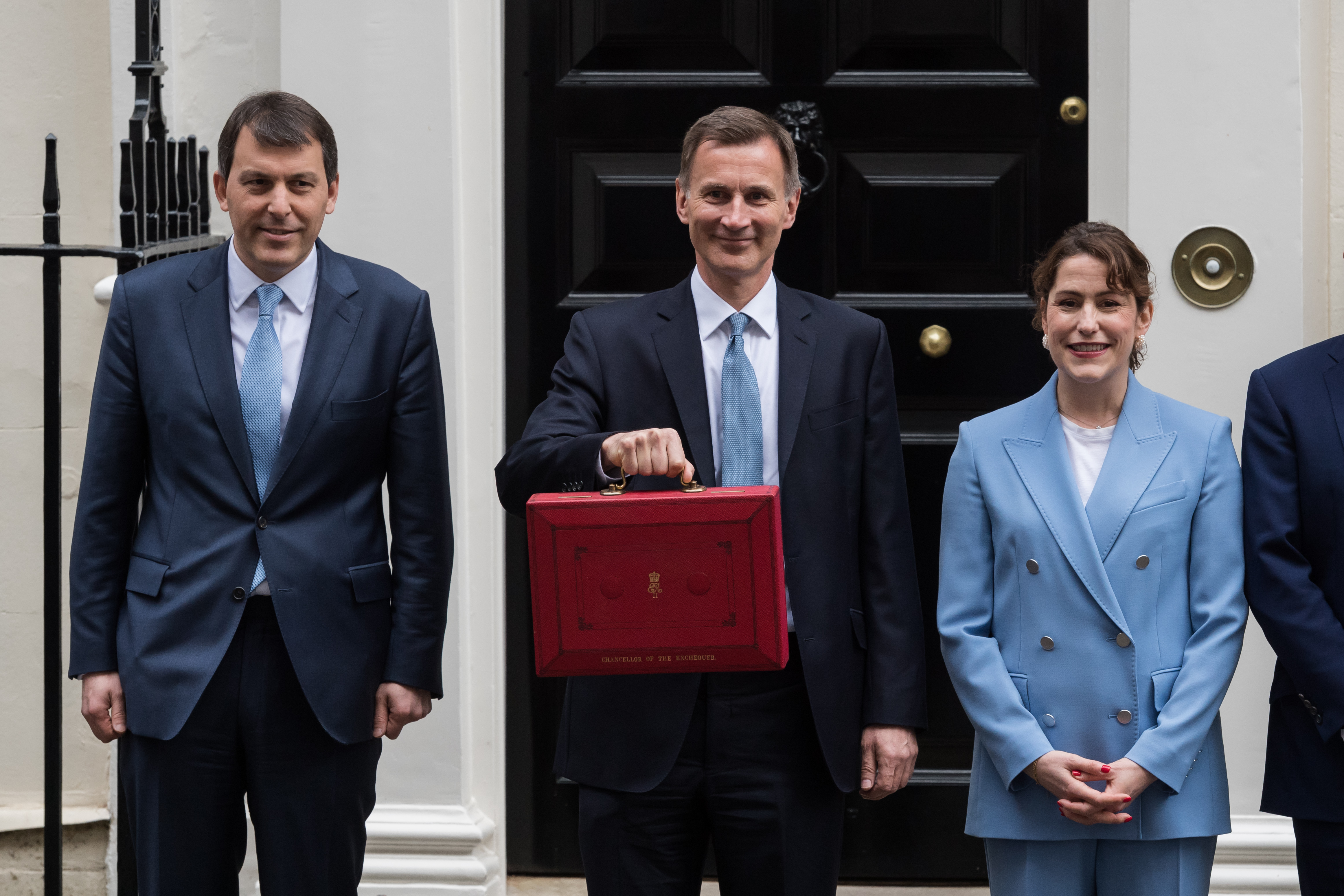 British Chancellor of the Exchequer Jeremy Hunt, centre, holds the budget briefcase outside 11 Downing Street ahead of last year’s unveiling of the budget in the House of Commons in London on March 15, 2023