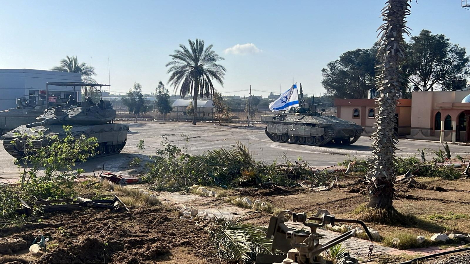 Israeli military vehicles operate in the Gazan side of the Rafah Crossing, amid the ongoing conflict between Israel and Palestinian Islamist group Hamas, in the southern Gaza Strip, in this handout image released on May 7, 2024. Israel Defense Forces/Handout via REUTERS THIS IMAGE HAS BEEN SUPPLIED BY A THIRD PARTY TPX IMAGES OF THE DAY