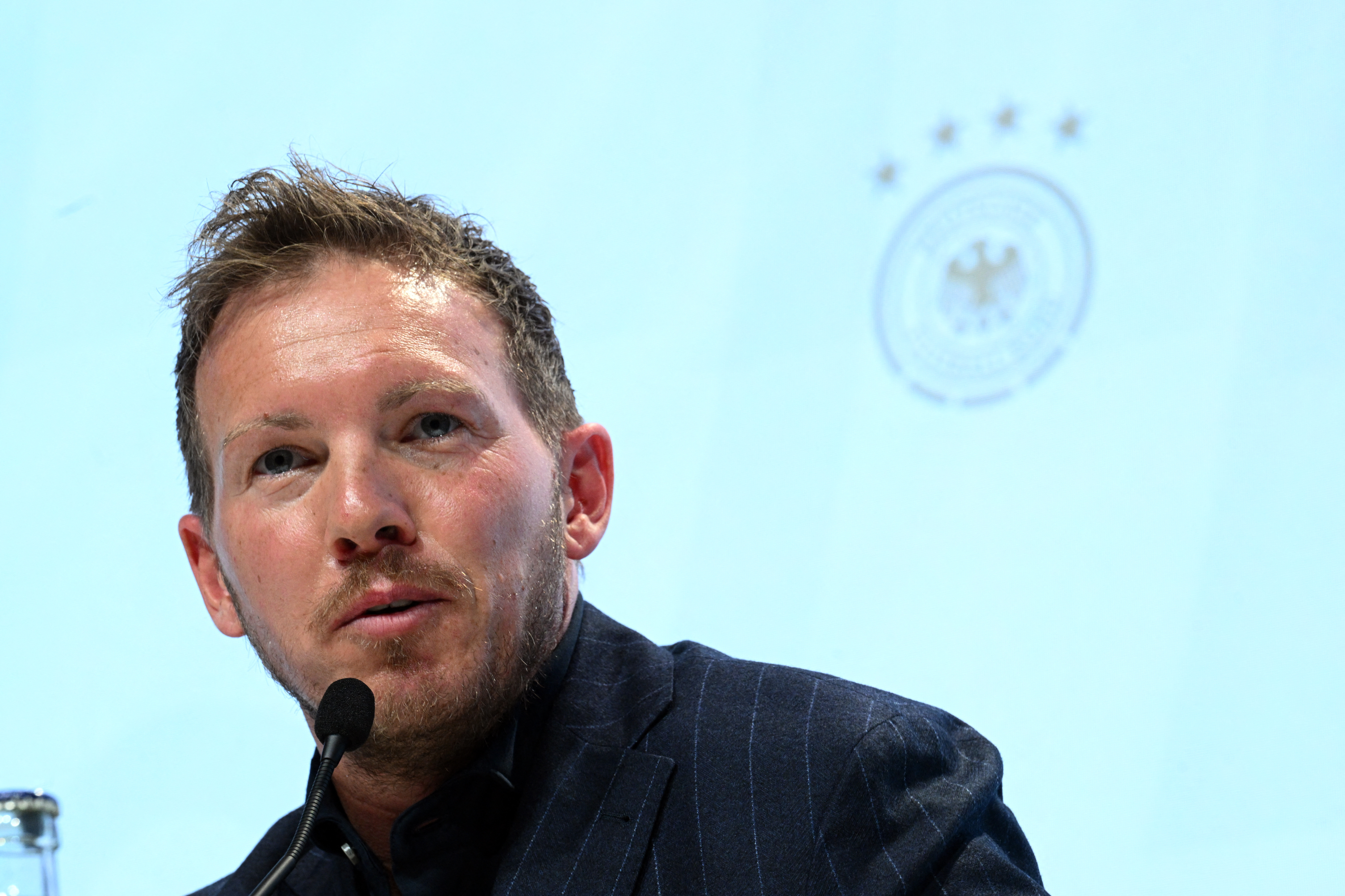 Man makes a speech at media conference.