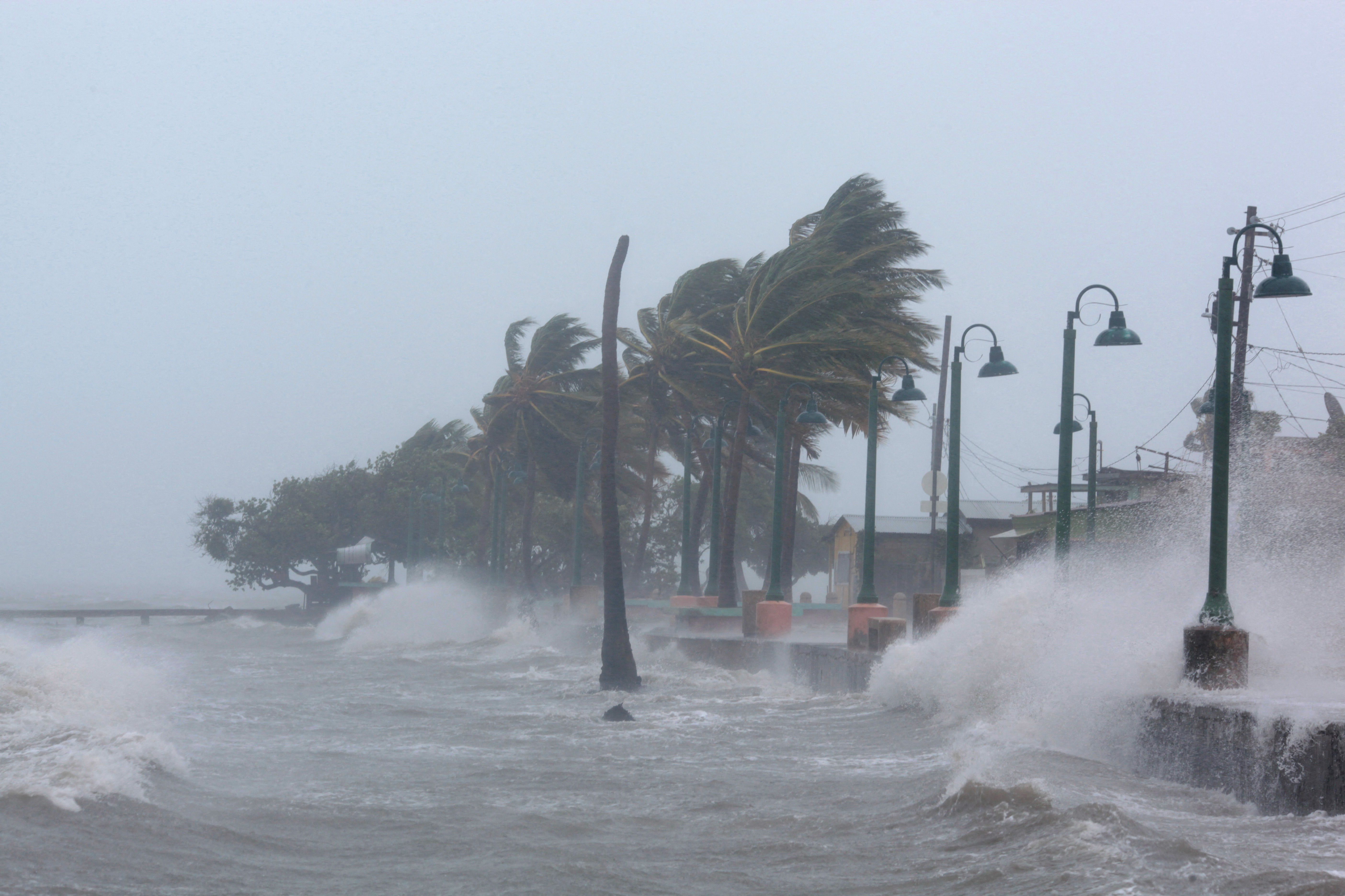 Waves crash against a seawall in Puerto Rico as a hurricane approaches