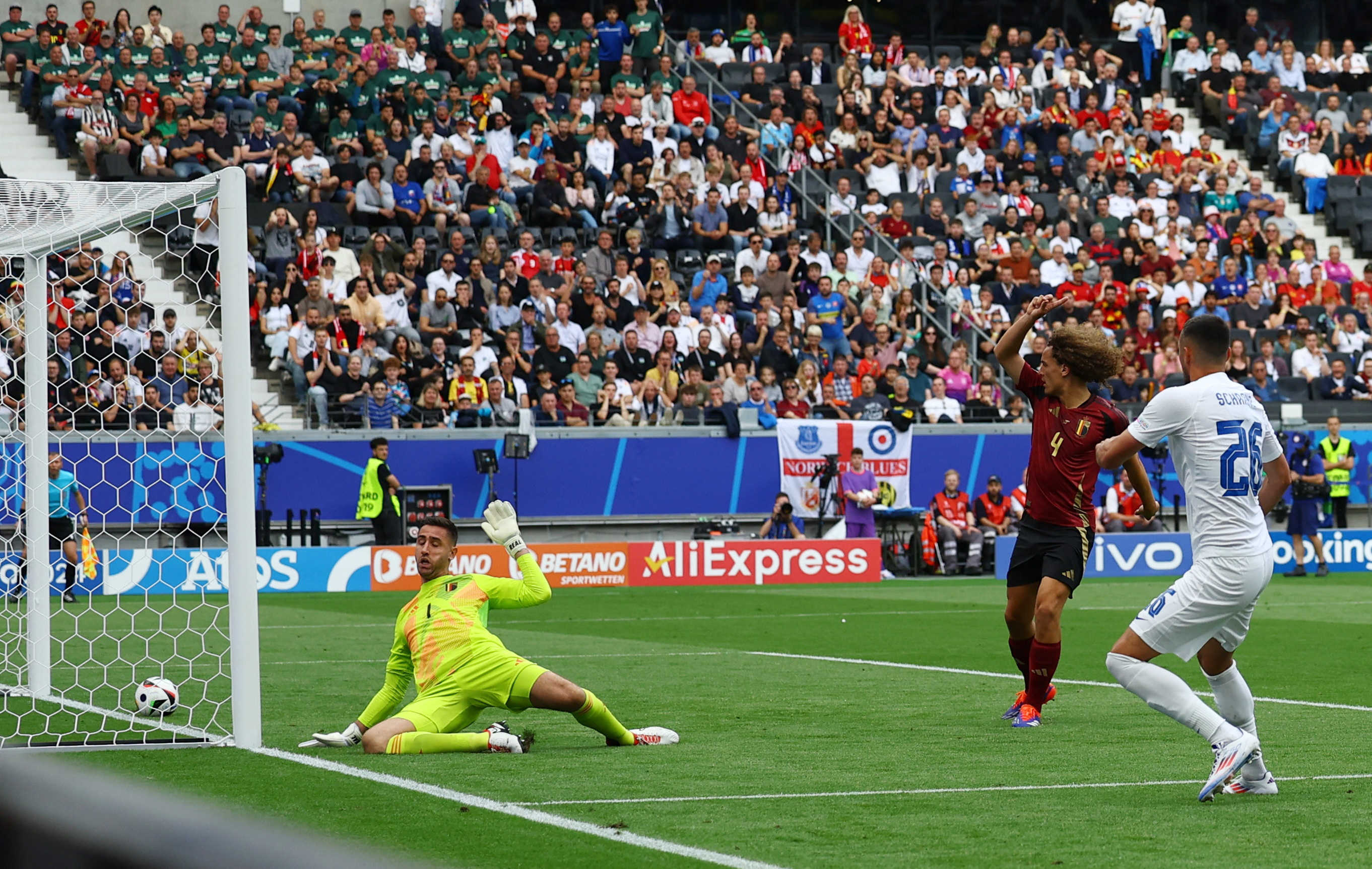 Football player scores goal.