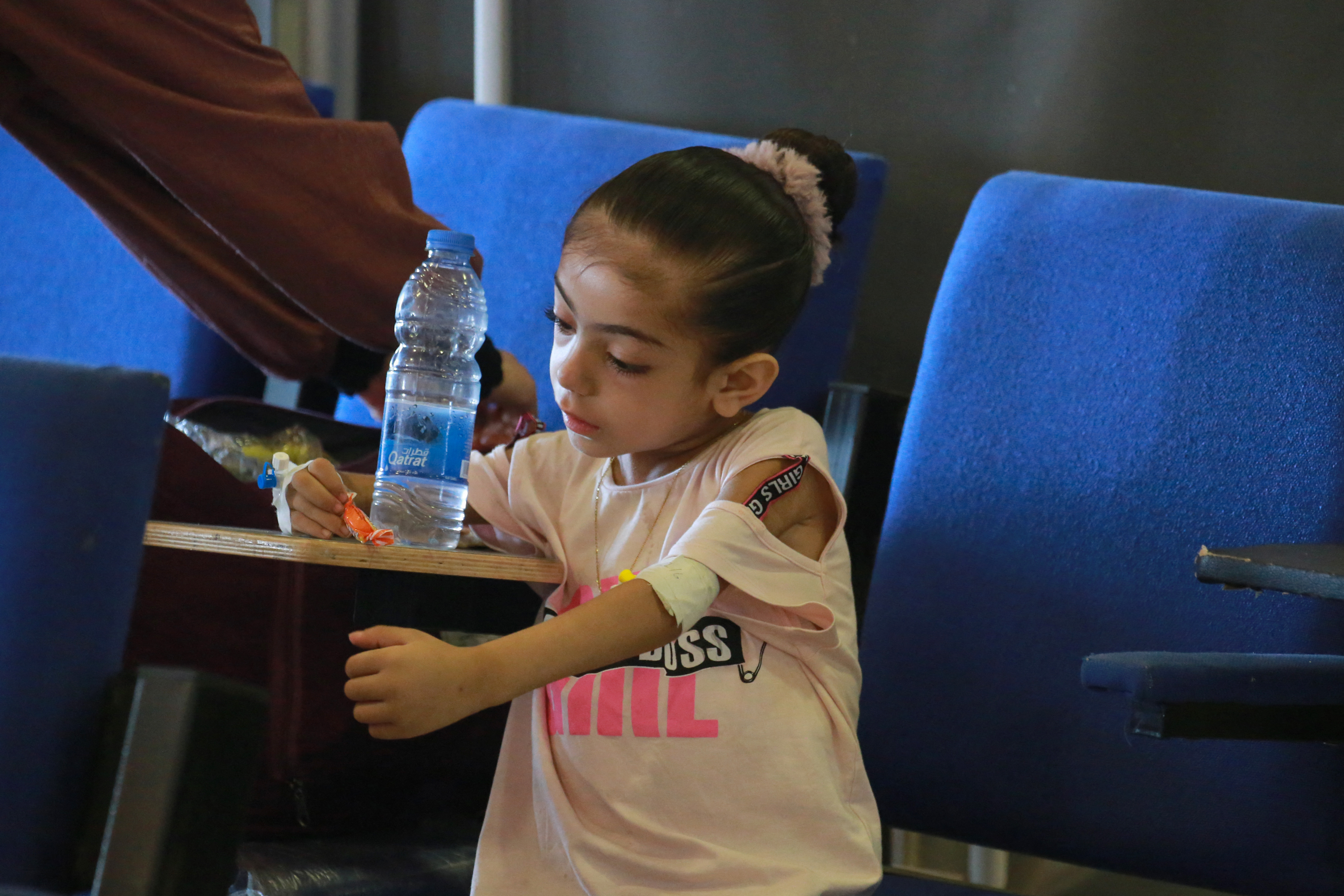 Palestinian children suffering of malnutrition or chronic diseases such as cancer, wait with family members at Nasser hospital in Khan Yunis in the southern Gaza Strip on June 24, 2024. [Bashar TALEB/AFP]