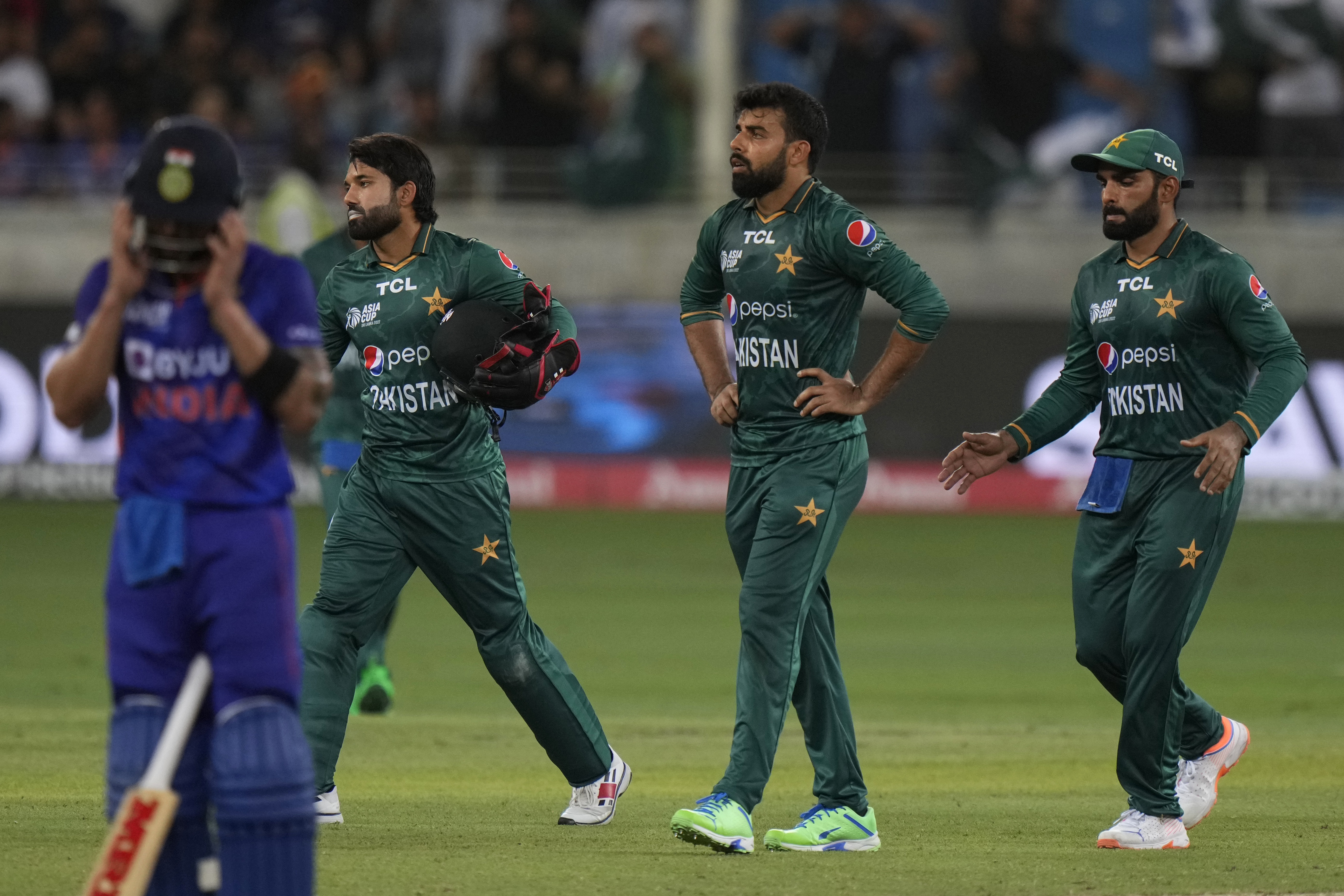 Pakistan’s Shadab Khan, second right, and teammates celebrate the dismissal of India’s Rishabh Pant during the T20 cricket match of Asia Cup between India and Pakistan, in Dubai, United Arab Emirates, September 4, 2022