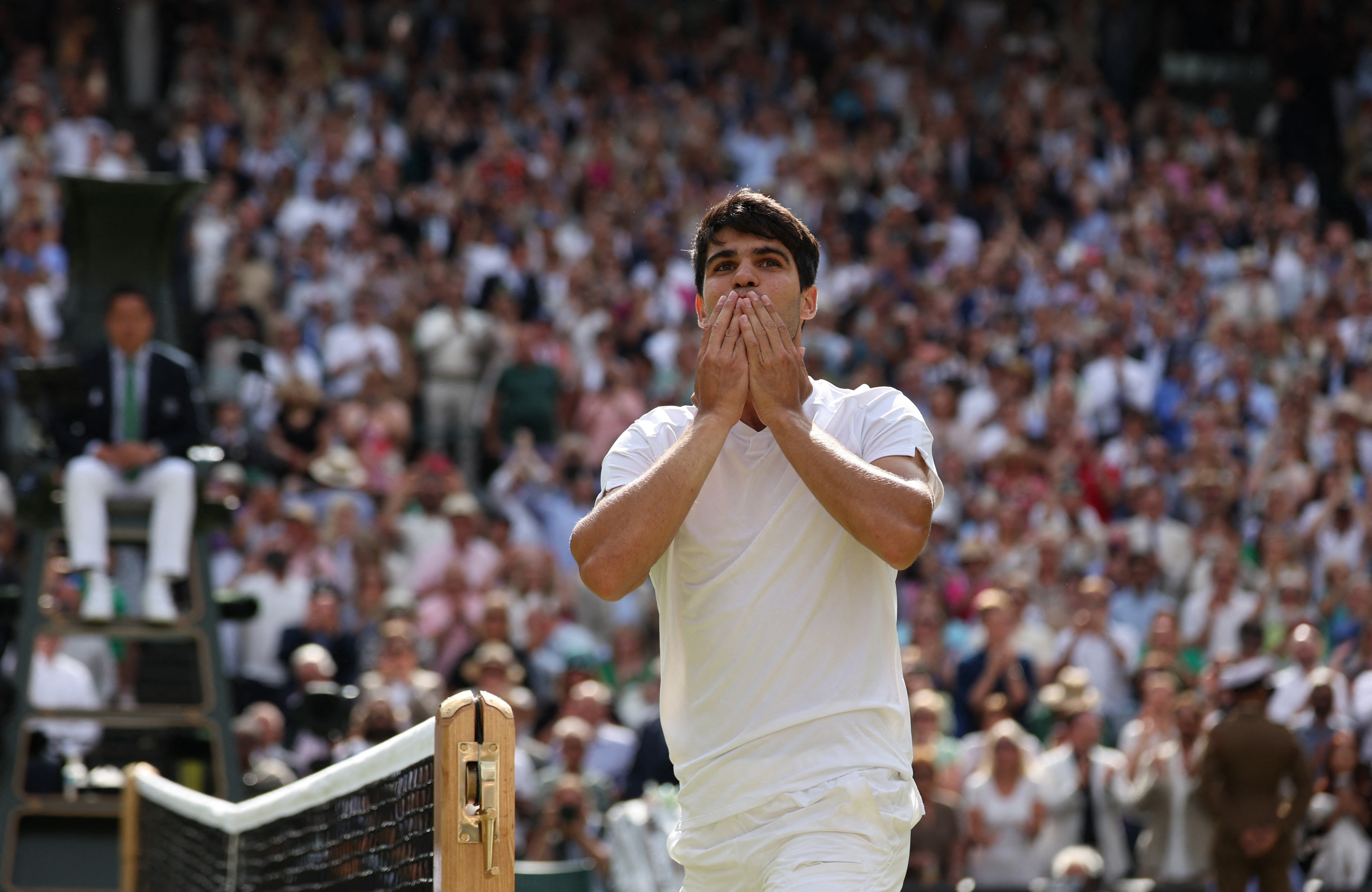 Tennis - Wimbledon - All England Lawn Tennis and Croquet Club, London, Britain - July 14, 2024 Spain's Carlos Alcaraz celebrates after winning the men's singles final against Serbia's Novak Djokovic REUTERS/Paul Childs