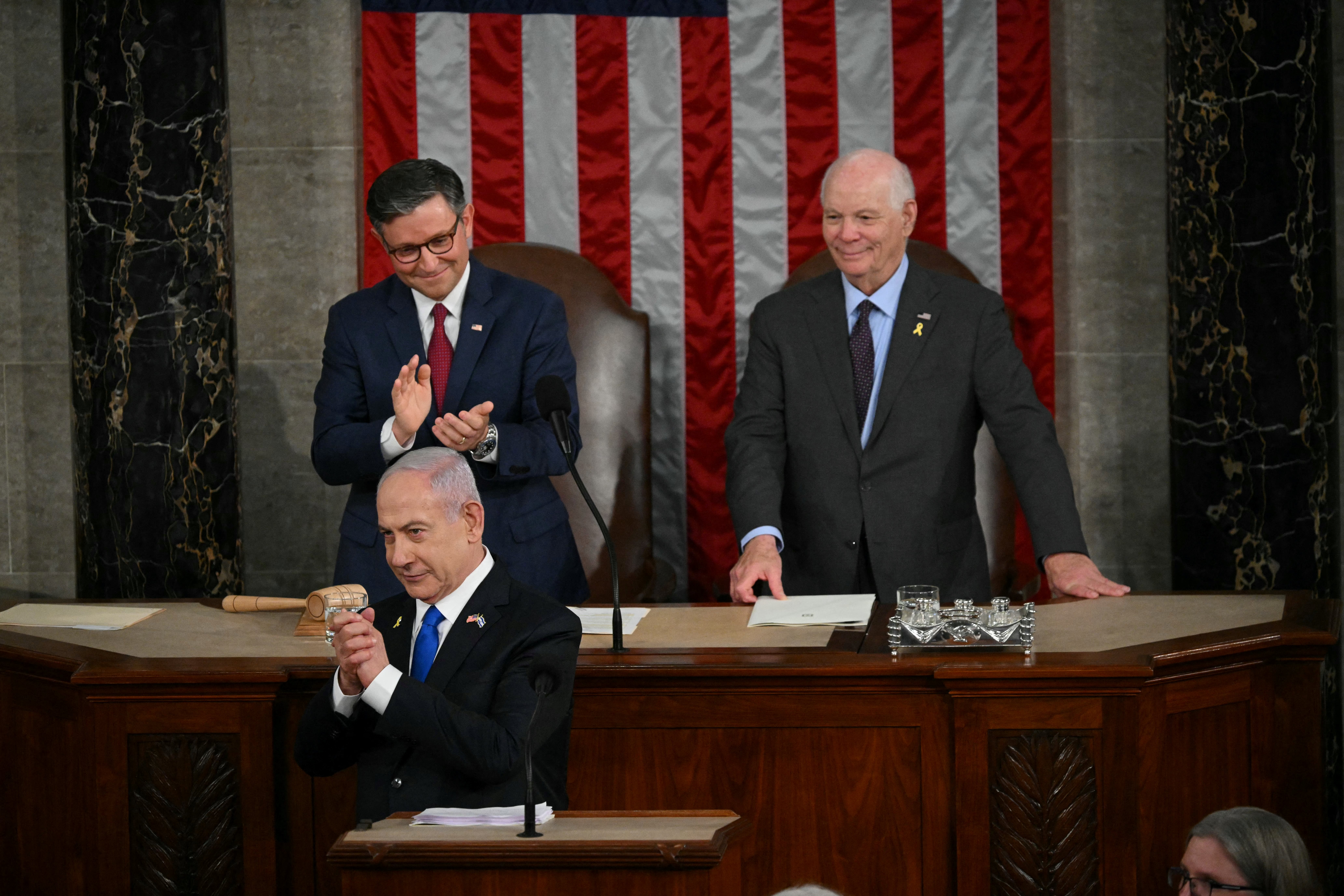 Israeli Prime Minister Benjamin Netanyahu acknowledges applause before addressing a joint meeting of Congress
