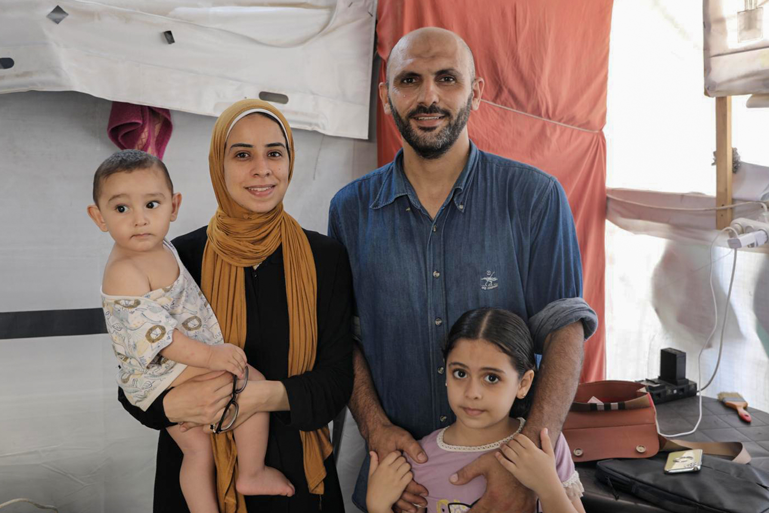 Maram Humaid in Gaza with her husband and children [Maram Humaid/Al Jazeera]