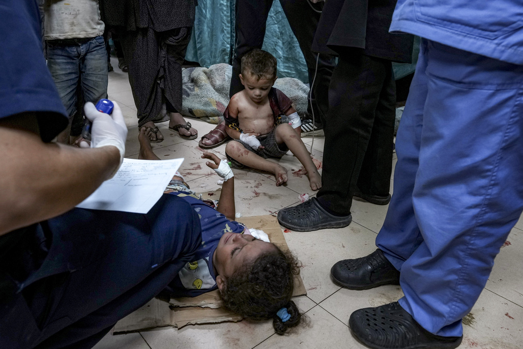 Palestinian children wounded in the Israeli bombardment of the Gaza Strip are treated in a hospital in Deir al-Balah, Thursday, Sept. 5, 2024. (AP Photo/Abdel Kareem Hana)