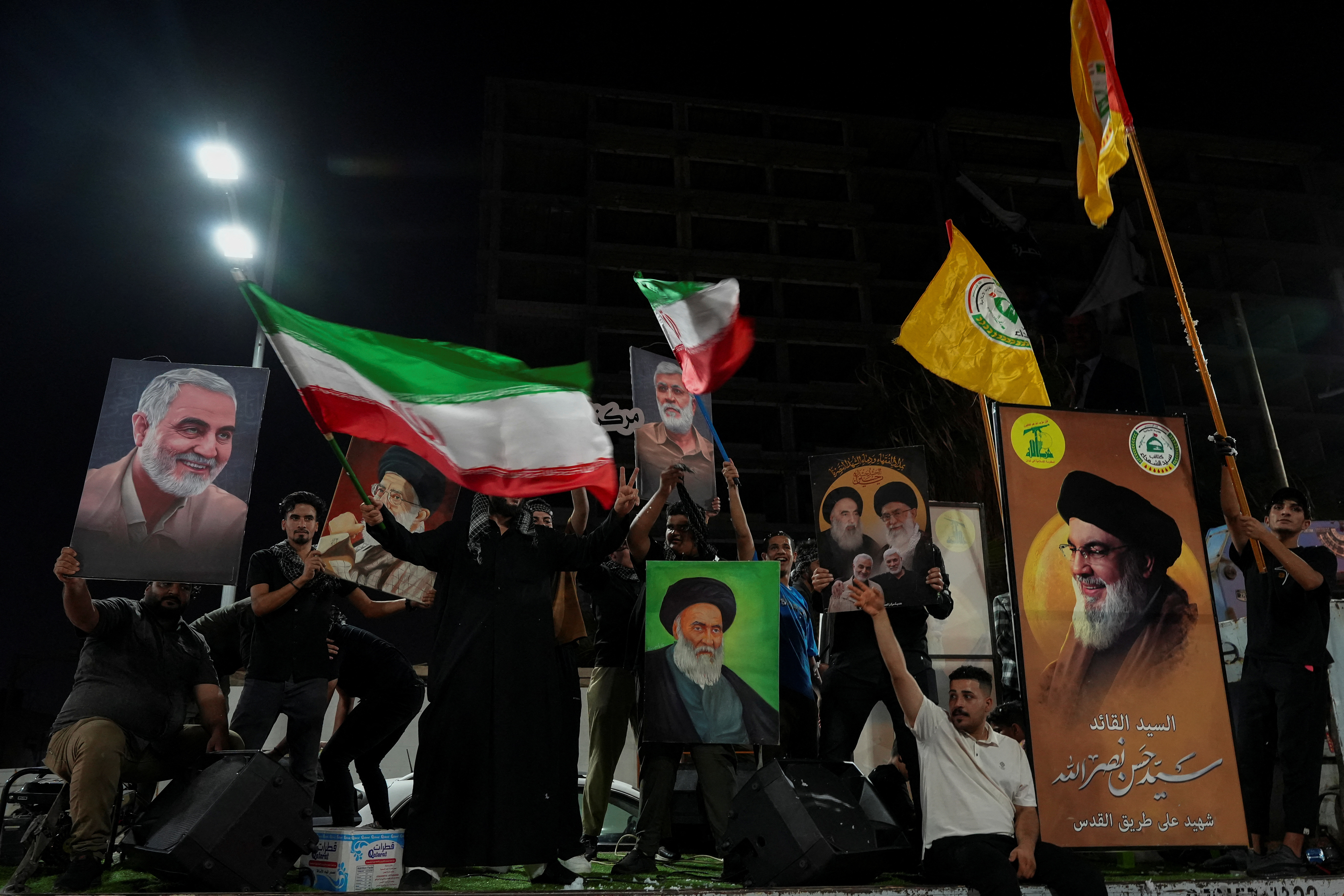 Iraqis celebrate the Iranian missile attack against Israel