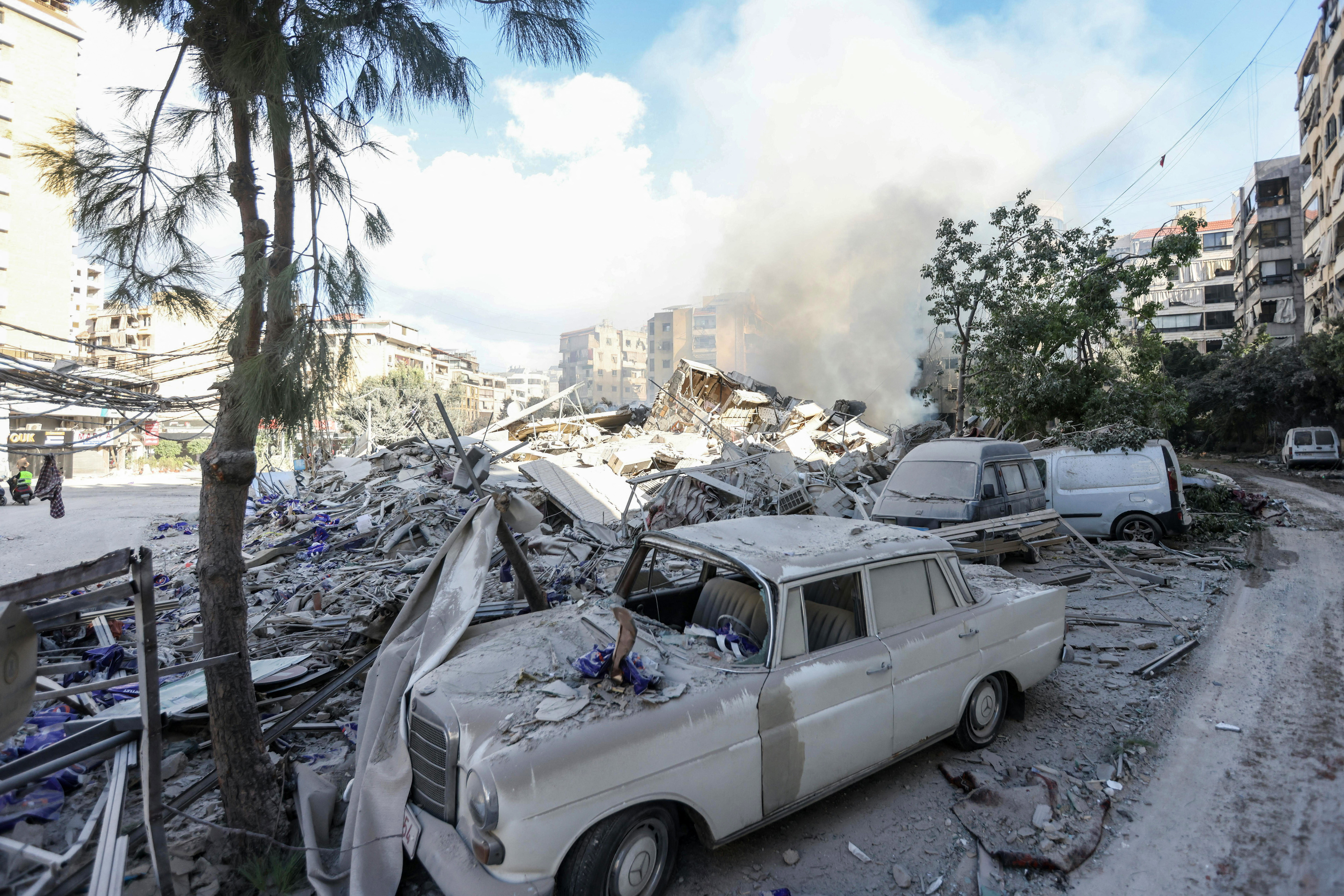 Smoke rises from the site of an overnight Israeli airstrike in Beirut's southern suburb of Hadath on October 2
