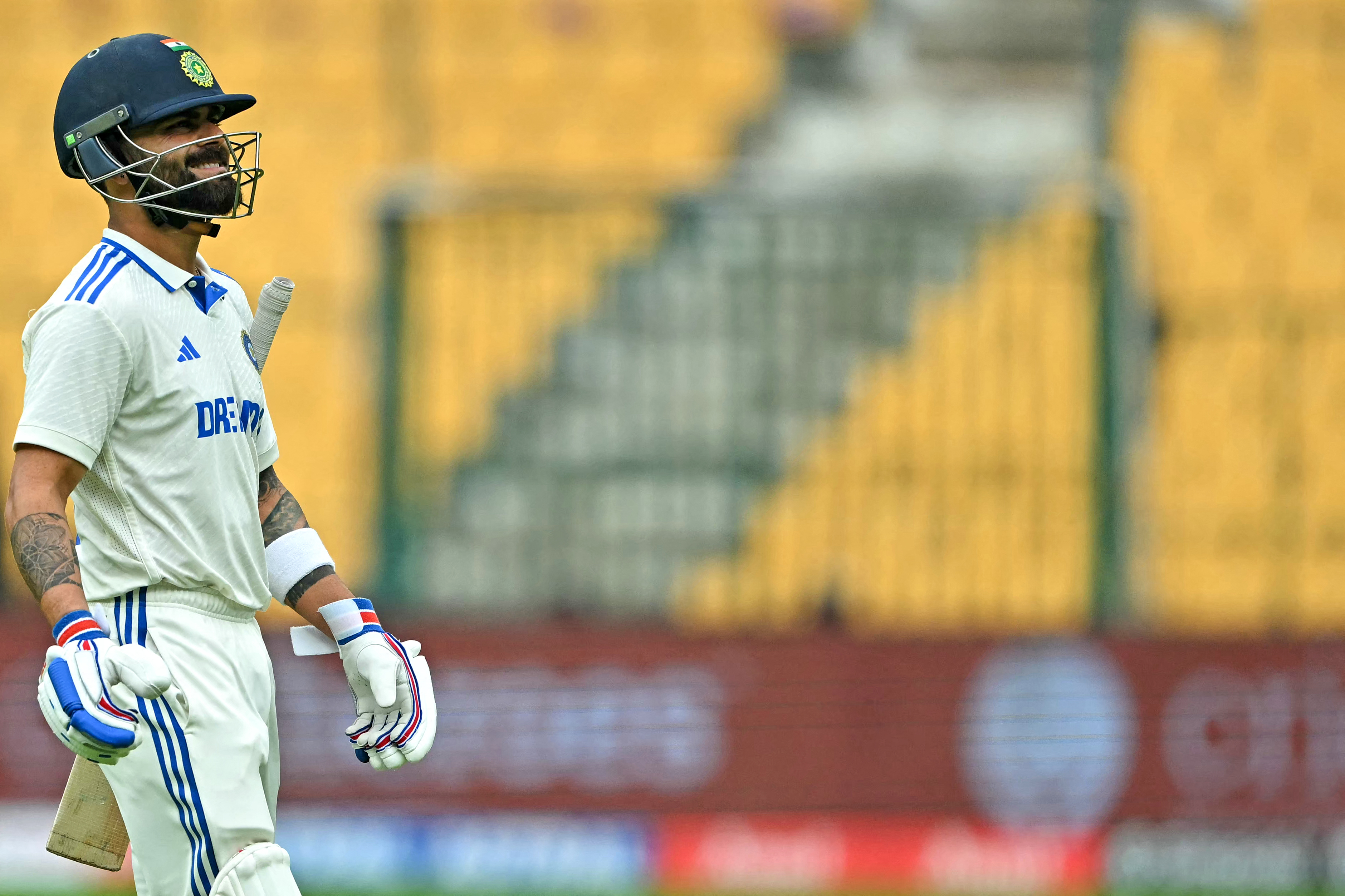 India's Virat Kohli walks back to the pavilion