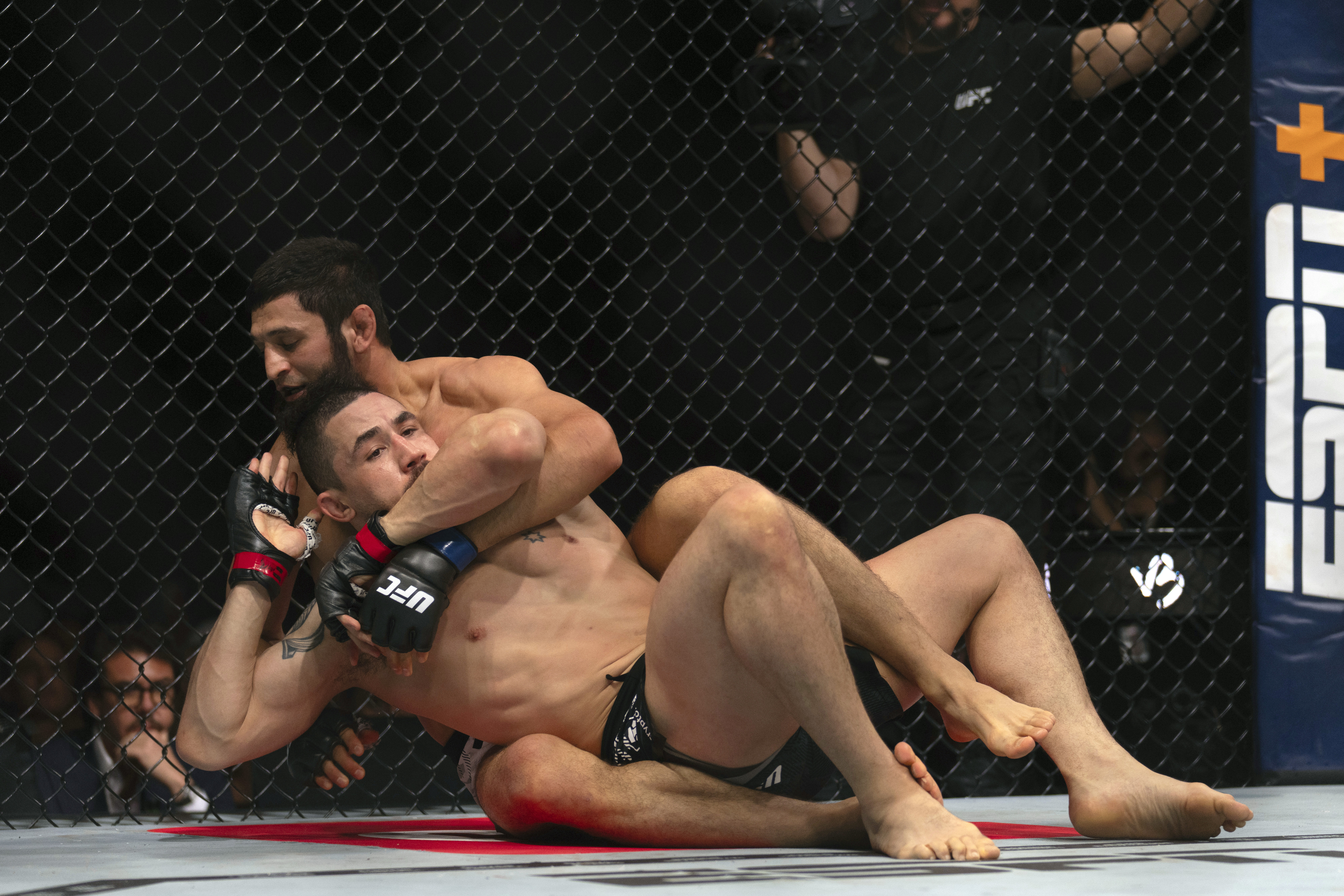 Khamzat Chimaev, back, chokes Robert Whittaker during a middleweight bout at UFC Fight Night on Saturday, October 26, 2024, in Abu Dhabi, United Arab Emirates