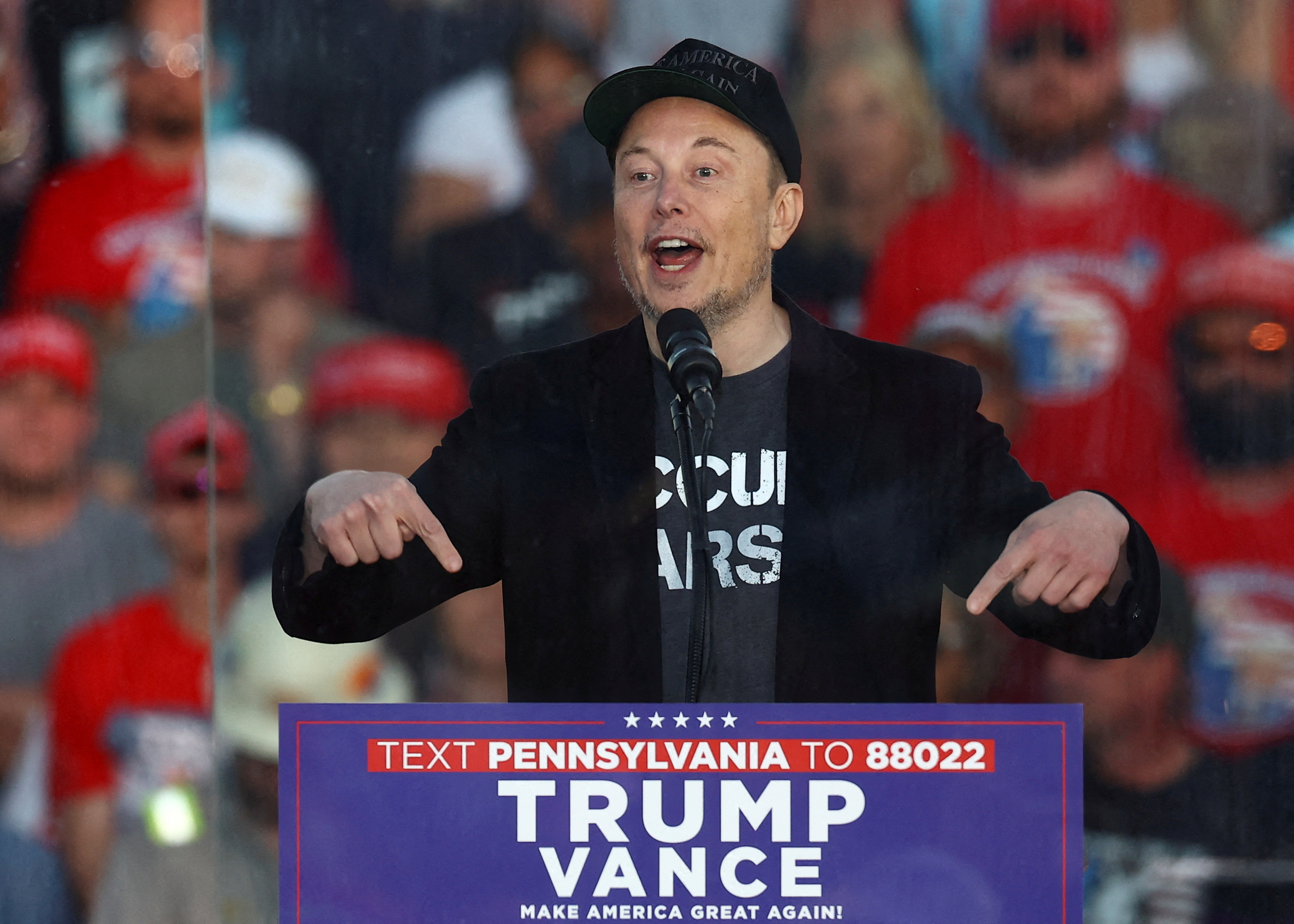 FILE PHOTO: Tesla CEO and X owner Elon Musk speaks during a rally for Republican presidential nominee and former U.S. president Donald Trump, at the site of the July assassination attempt against Trump, in Butler, Pennsylvania