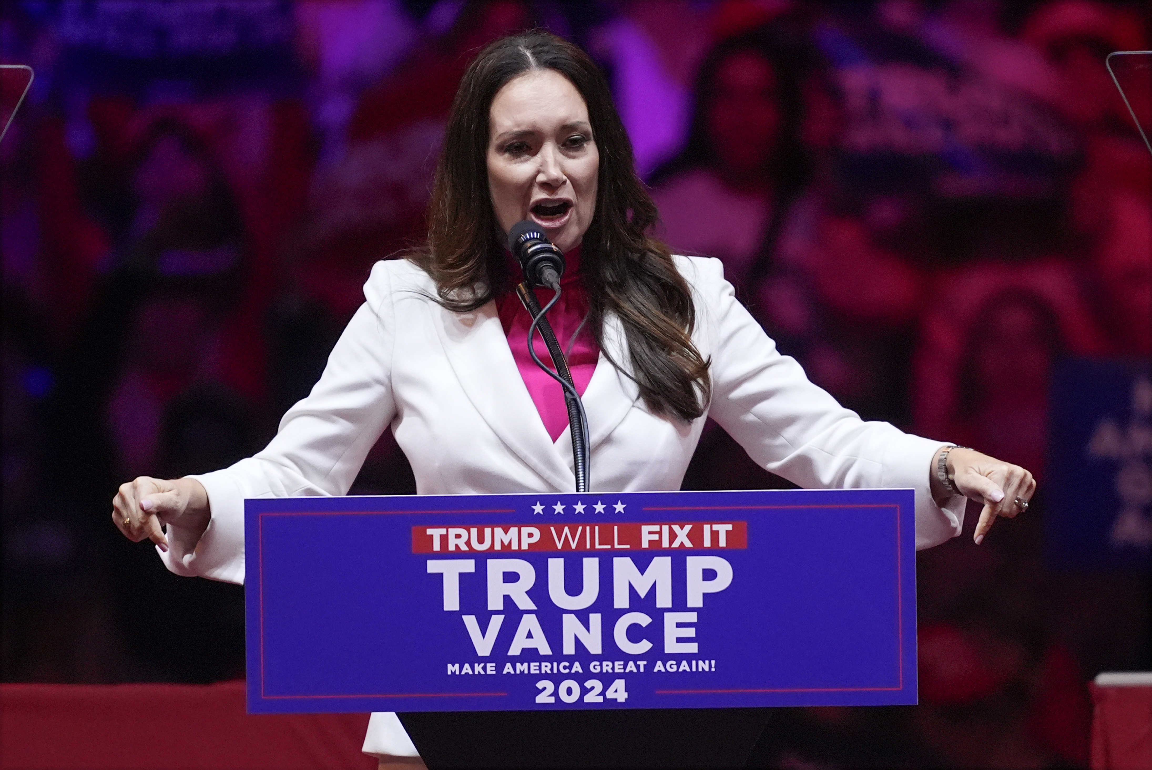 Brooke Rollins speaks behind a "Trump Vance 2024" podium.