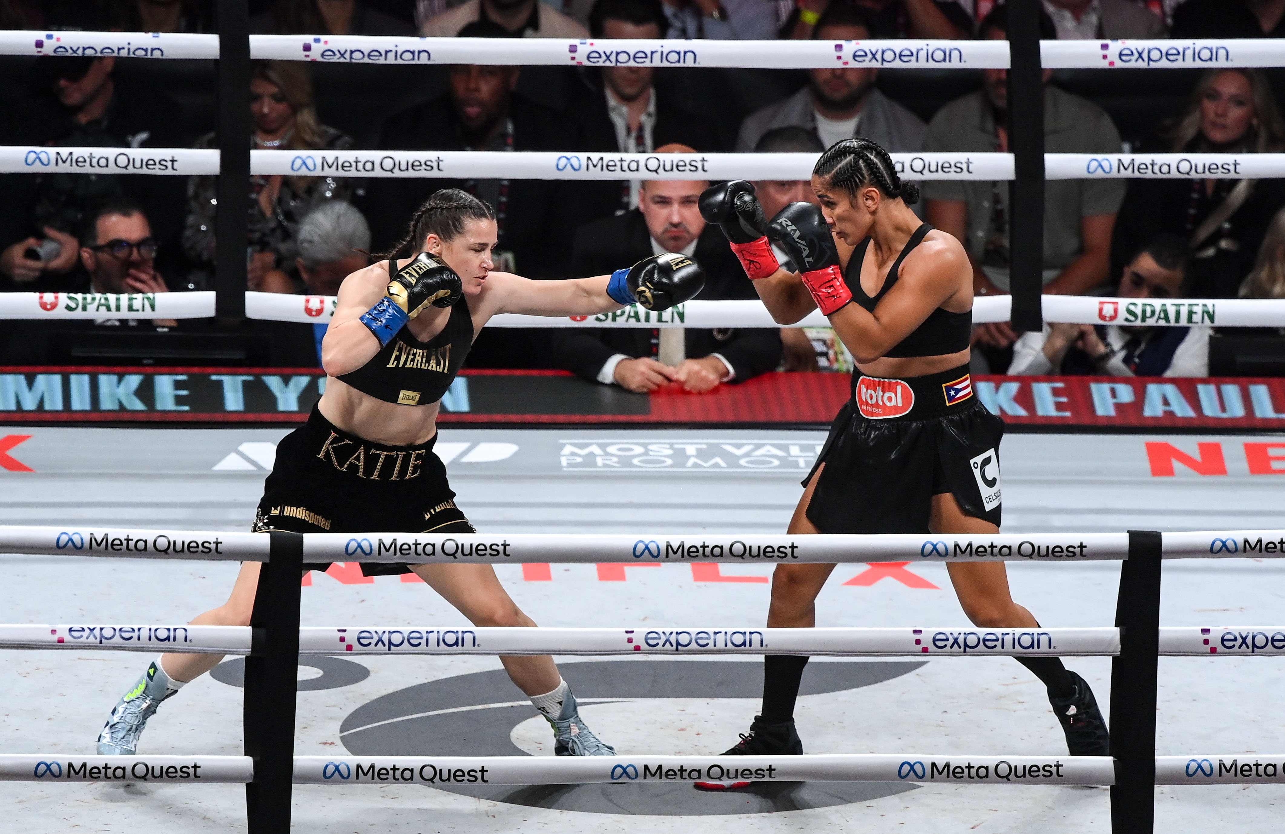 Katie Taylor, left, and Amanda Serrano in the first round during their undisputed super lightweight championship fight