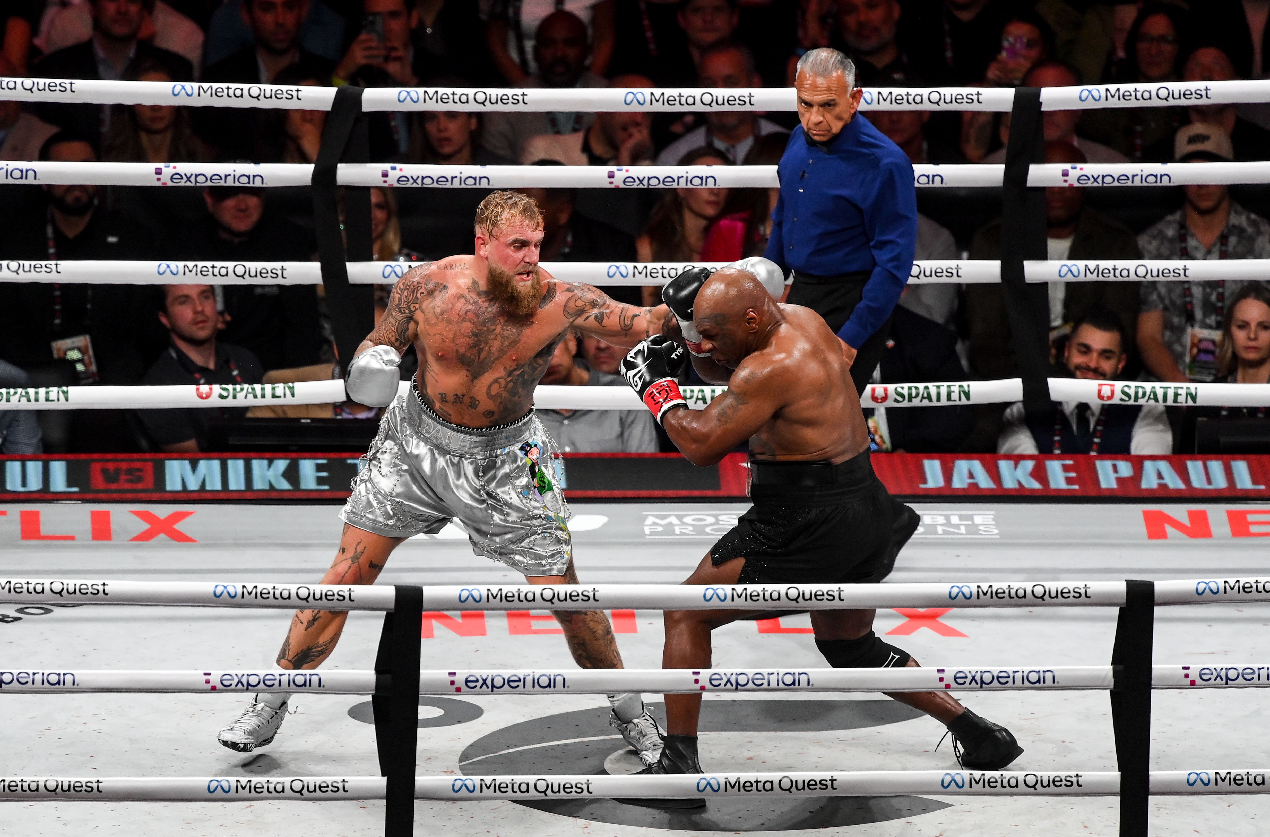 Jake Paul, left, kept Mike Tyson the power of the former champion at bay thanks to his superior reach and speed