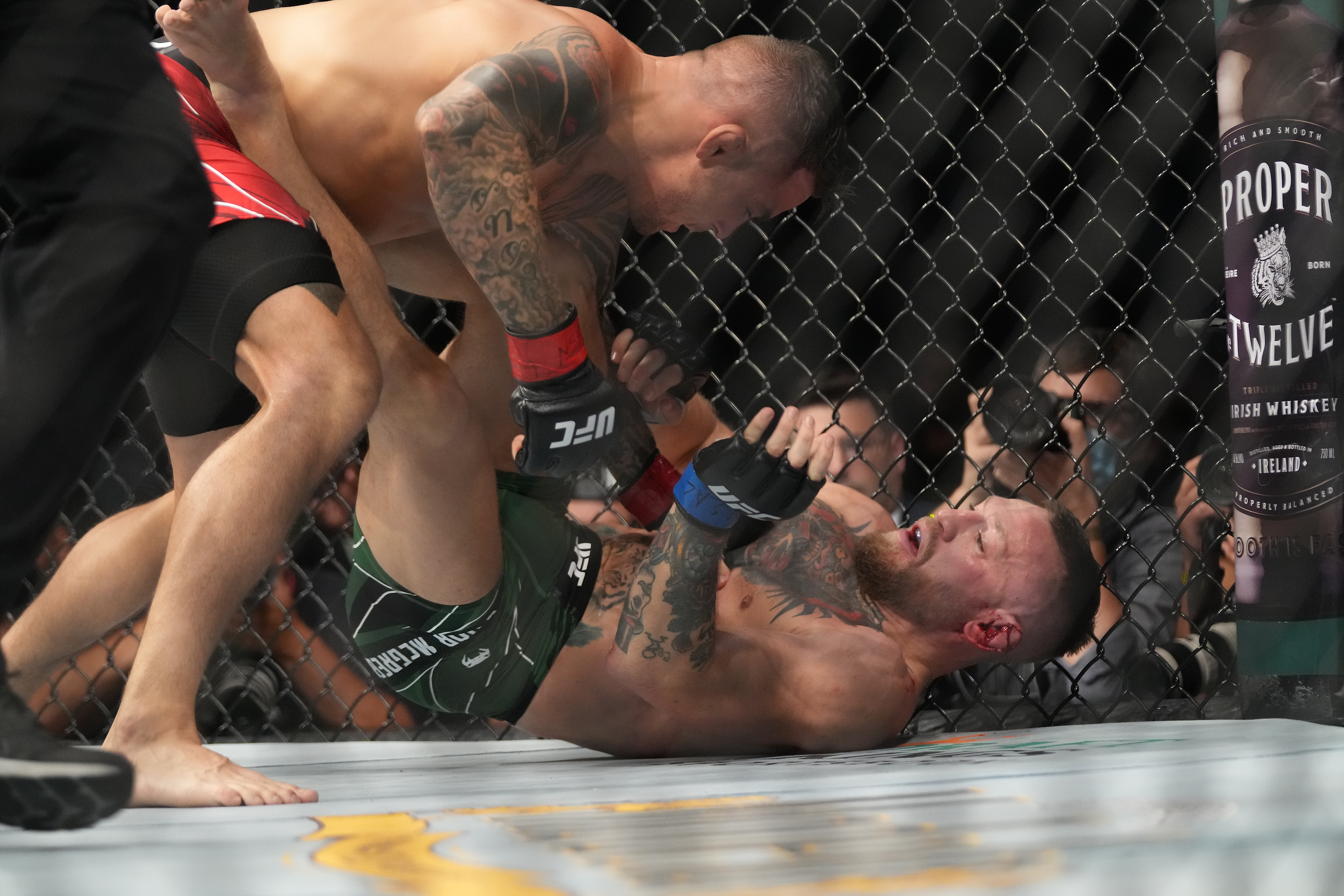 LAS VEGAS, NV - JULY 10: Conor McGregor and Dustin Poirier (top) grapple in their lightweight bout during UFC 264 at T-Mobile Arena on July 10, 2021, in Las Vegas, Nevada, United States. (Photo by Louis Grasse/PxImages/Icon Sportswire via Getty Images)