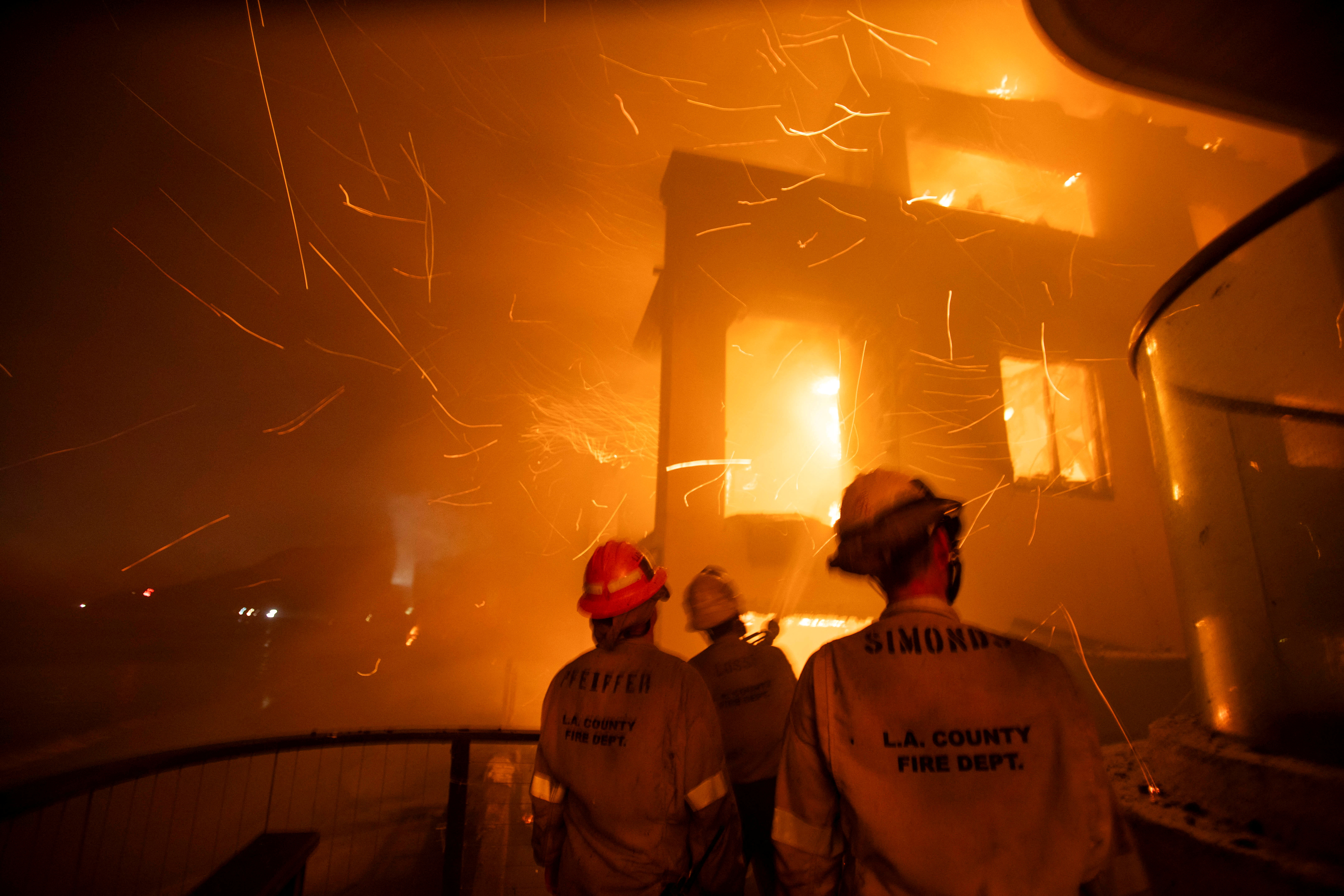 Firefighters battle the Palisades fire as it burns during a windstorm on the west side of Los Angeles, California, U.S. January 8, 2025. REUTERS/Ringo Chiu