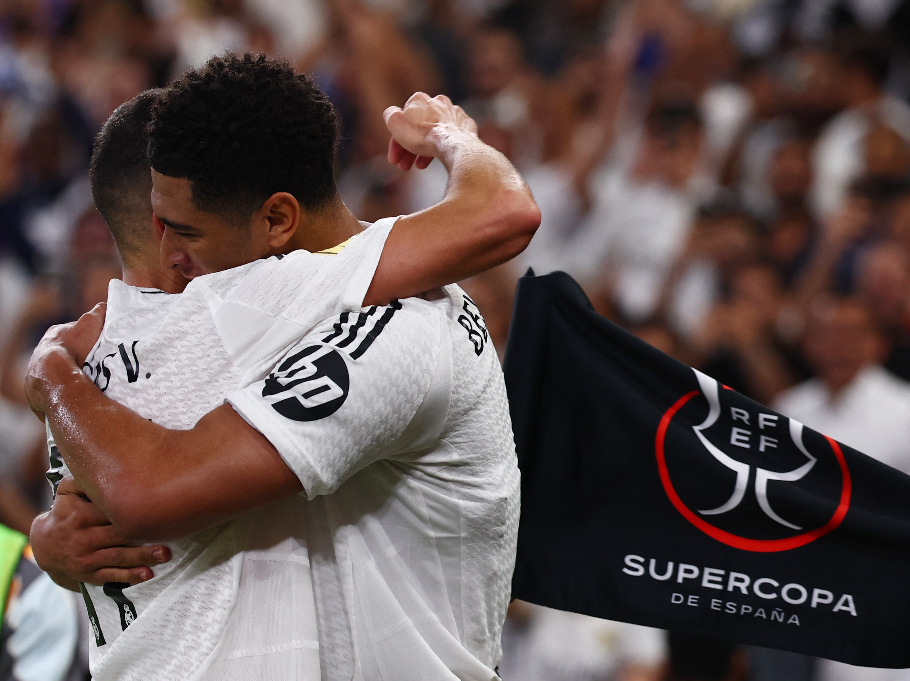 Soccer Football - Spanish Super Cup - Semi Final - Real Madrid v RCD Mallorca - King Abdullah Sports City, Jeddah, Saudi Arabia - January 9, 2025 Real Madrid's Jude Bellingham celebrates scoring their first goal with Lucas Vazquez REUTERS/Pedro Nunes