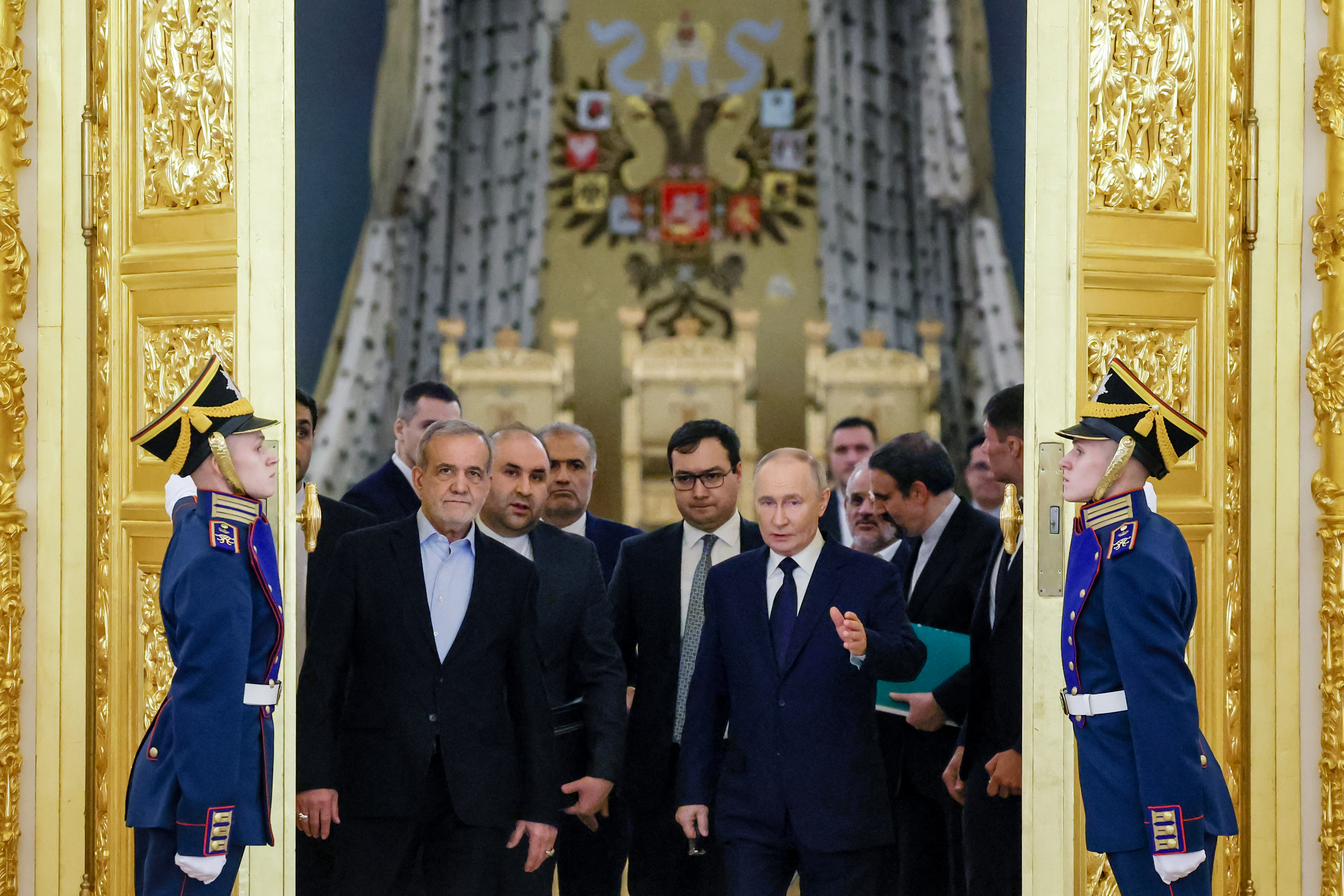 In this pool photograph distributed by the Russian state agency Sputnik, Russia's President Vladimir Putin and Iranian President Masoud Pezeshkian meet at the Kremlin in Moscow on January 17, 2025. (Photo by Vyacheslav PROKOFYEV / POOL / AFP